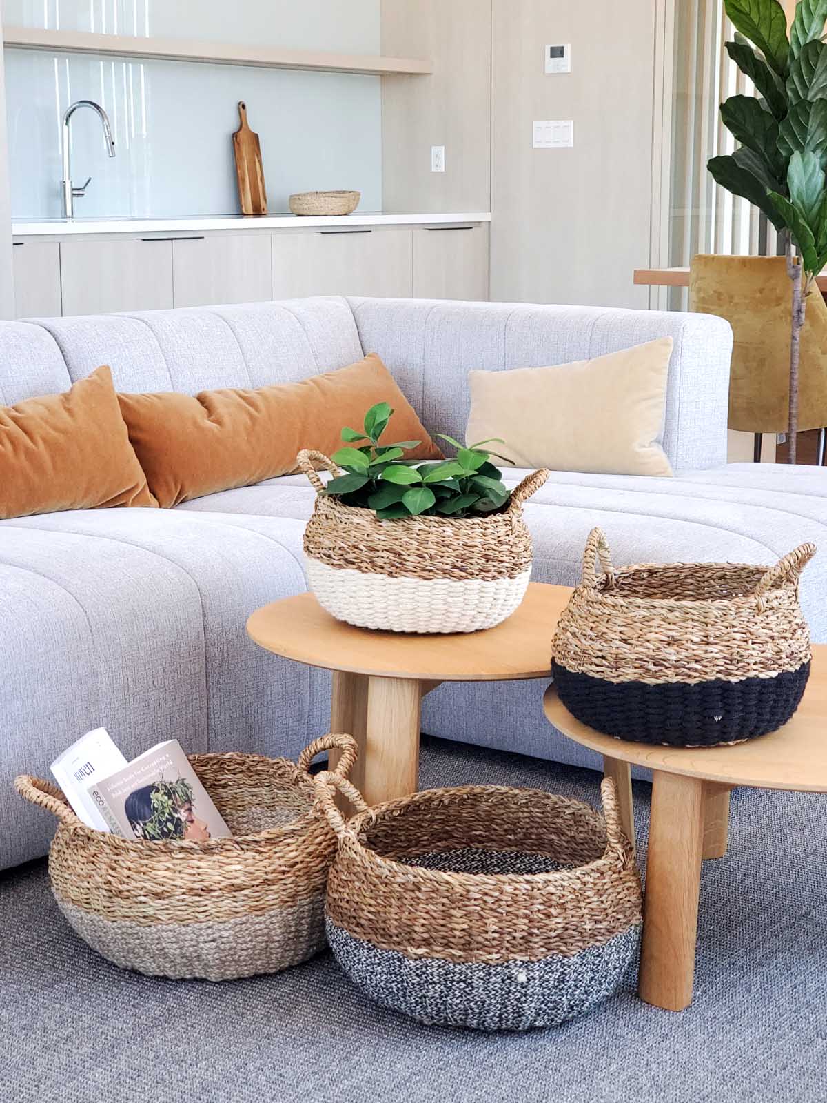 Ula Floor Basket in natural color, made from seagrass and jute, showcasing its stylish and multifunctional design.