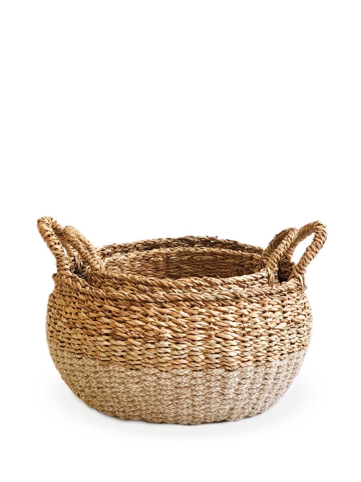 Ula Floor Basket in natural color, made from seagrass and jute, showcasing its stylish and multifunctional design.