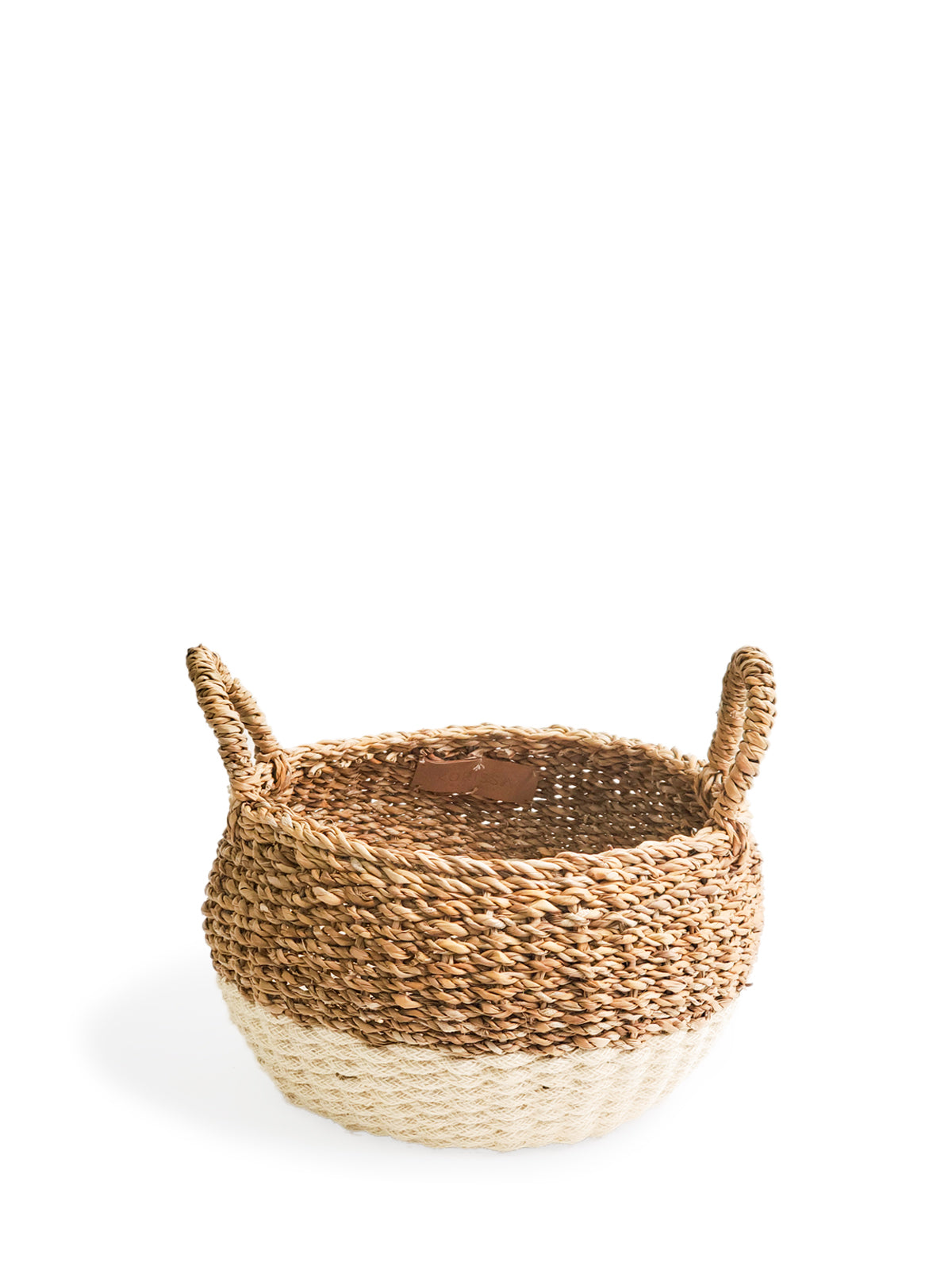 Ula Floor Basket in natural color, made from seagrass and jute, showcasing its stylish and multifunctional design.