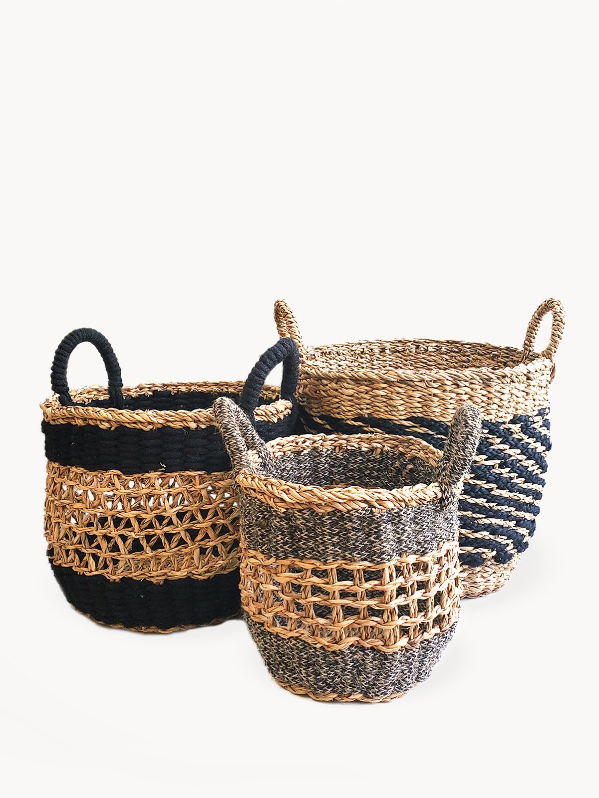 Ula Mesh Basket in Black, handcrafted from seagrass and jute, showcasing a stylish and versatile design for home organization.