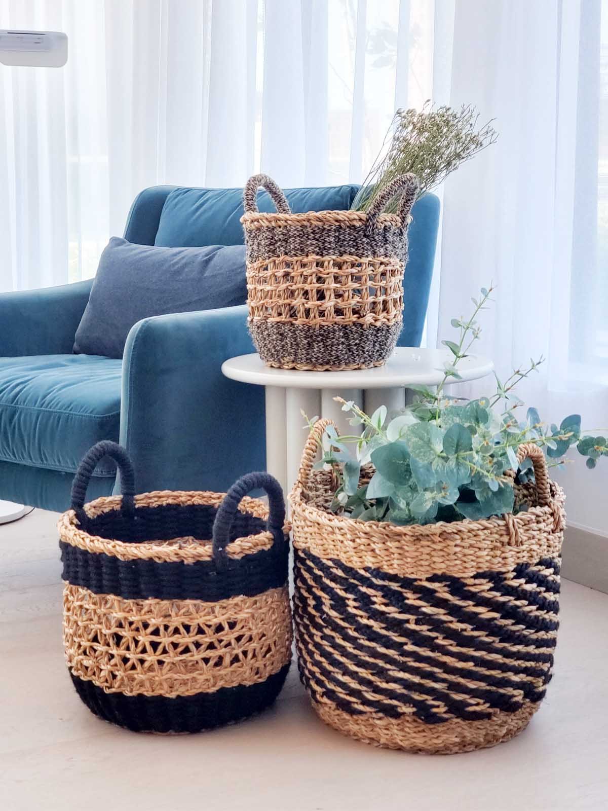 Ula Mesh Basket in Black, handcrafted from seagrass and jute, showcasing a stylish and versatile design for home organization.