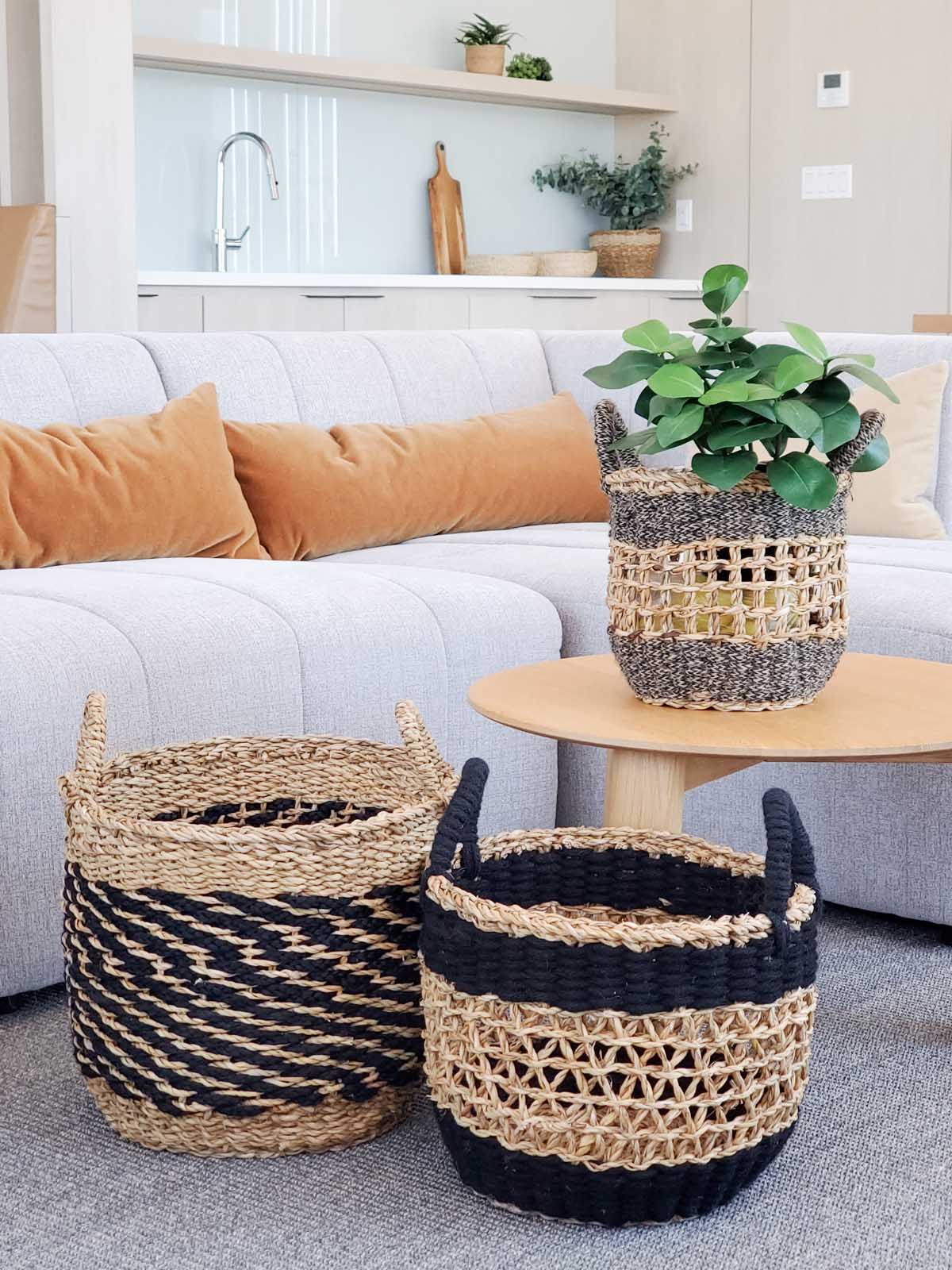 Ula Mesh Basket in Black, handcrafted from seagrass and jute, showcasing a stylish and versatile design for home organization.