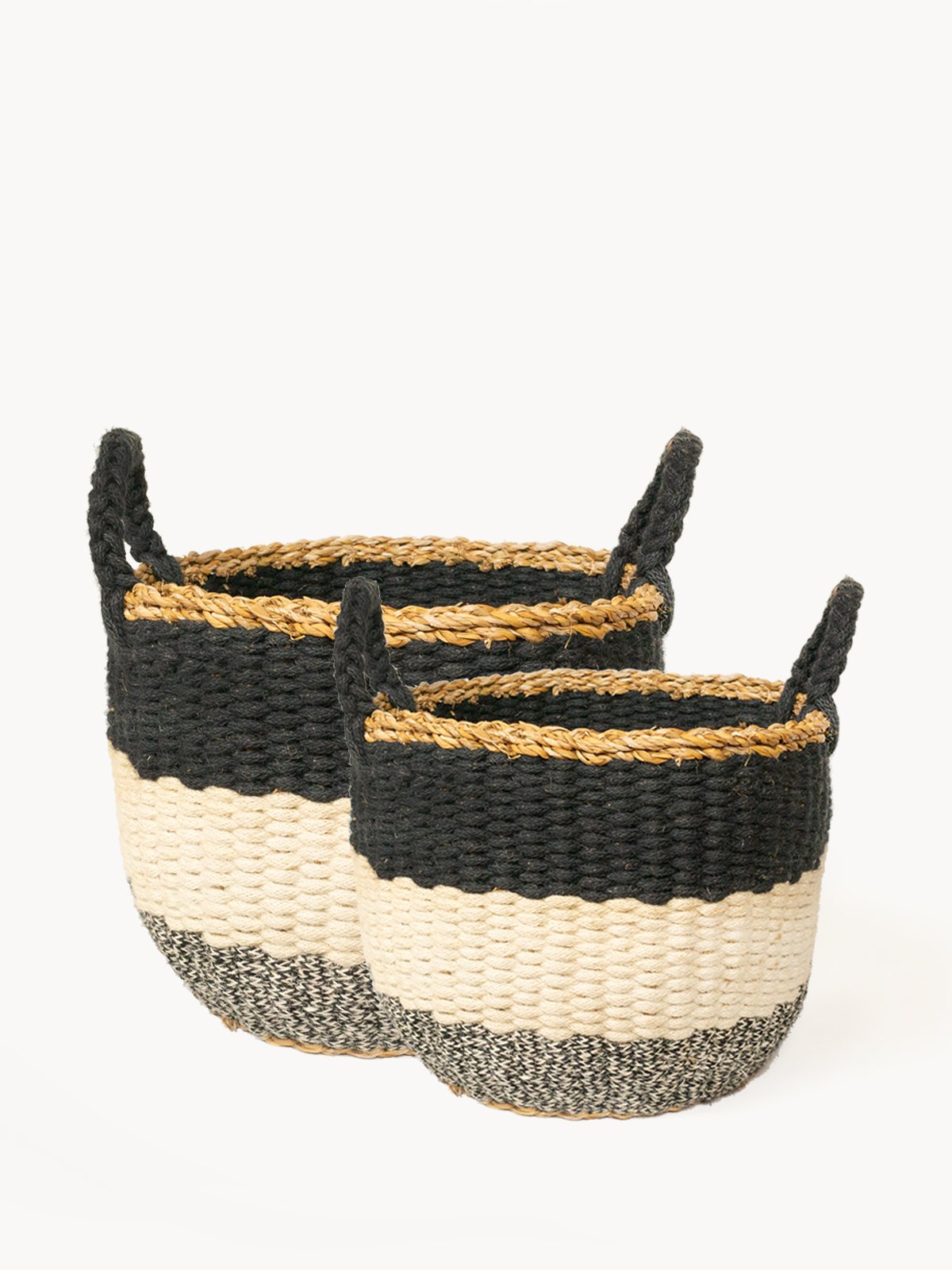 Ula Stripe Basket in Black, handwoven from seagrass and jute, featuring a stylish black and white stripe design, perfect for home storage.