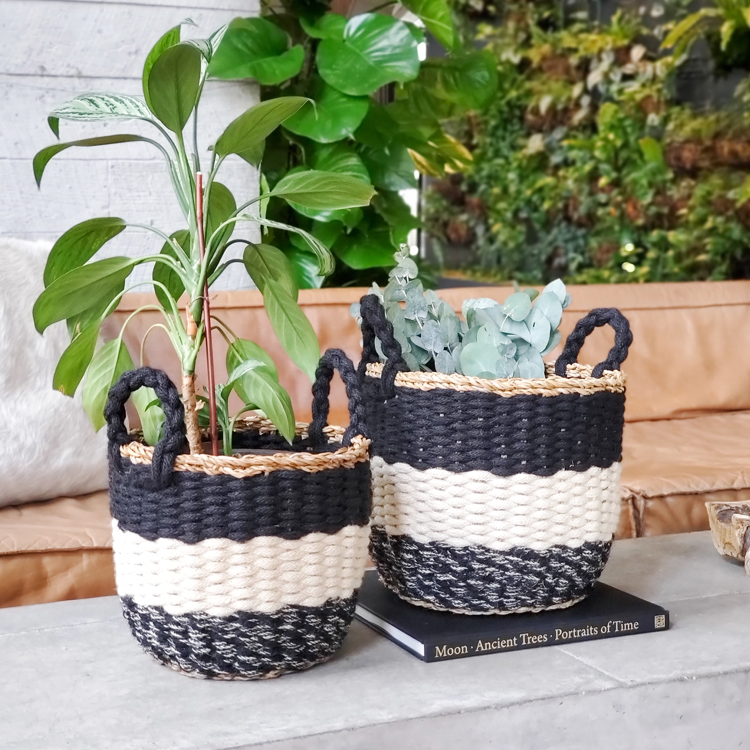 Ula Stripe Basket in Black, handwoven from seagrass and jute, featuring a stylish black and white stripe design, perfect for home storage.