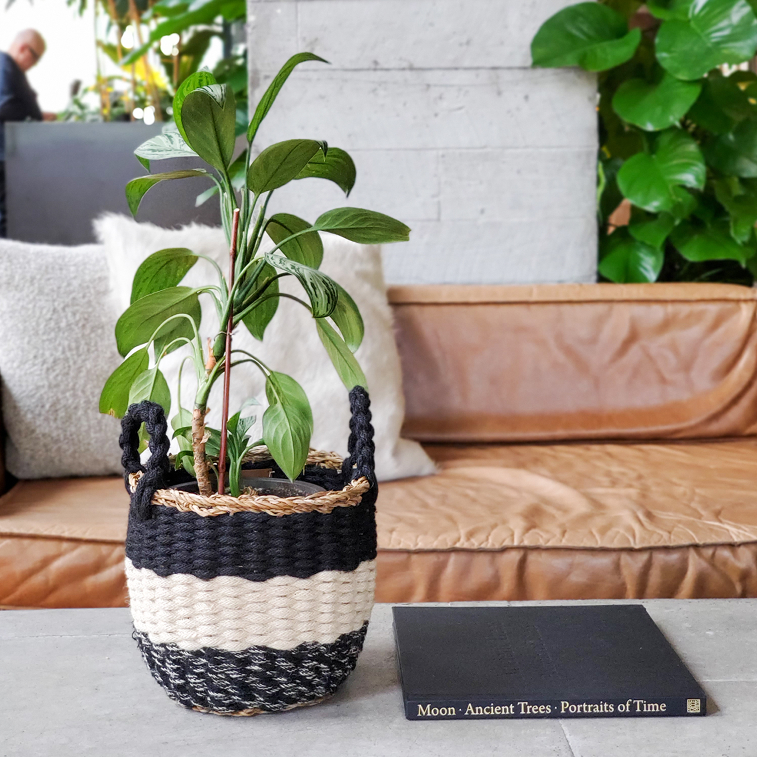 Ula Stripe Basket in Black, handwoven from seagrass and jute, featuring a stylish black and white stripe design, perfect for home storage.