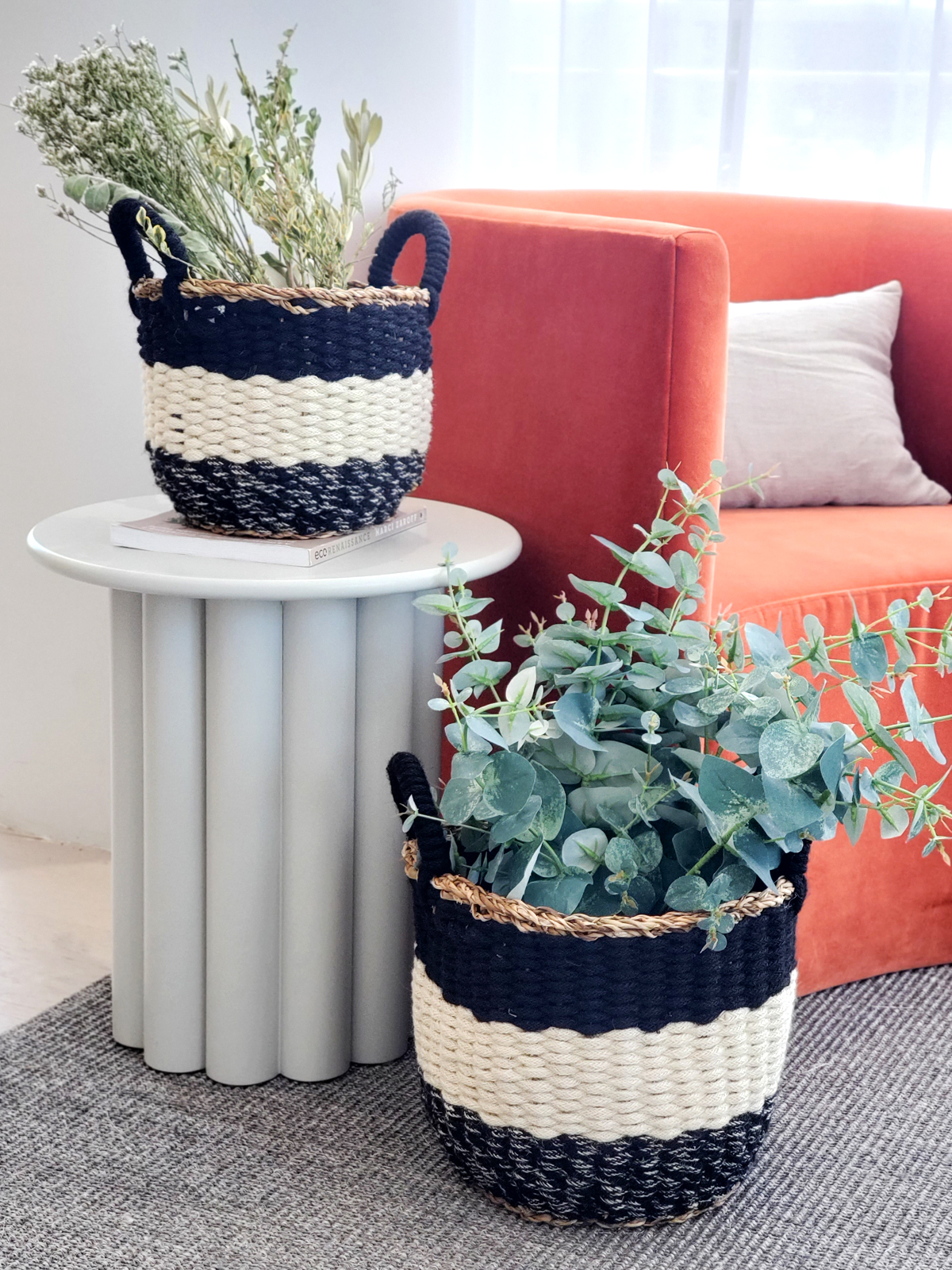 Ula Stripe Basket in Black, handwoven from seagrass and jute, featuring a stylish black and white stripe design, perfect for home storage.