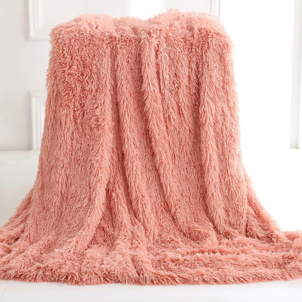 Ultra Soft Faux Fur Throw Blanket in pink, gray, white, and coffee colors, showcasing its plush texture and reversible design.