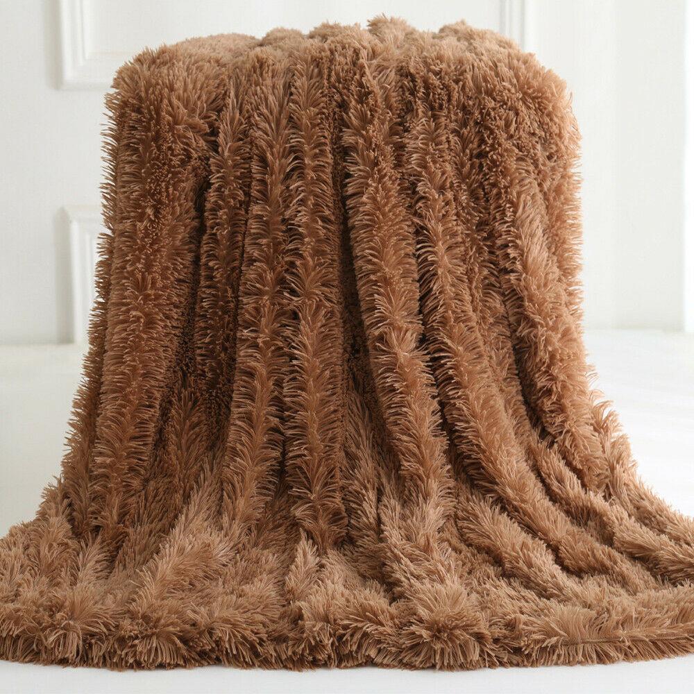 Ultra Soft Faux Fur Throw Blanket in pink, gray, white, and coffee colors, showcasing its plush texture and reversible design.