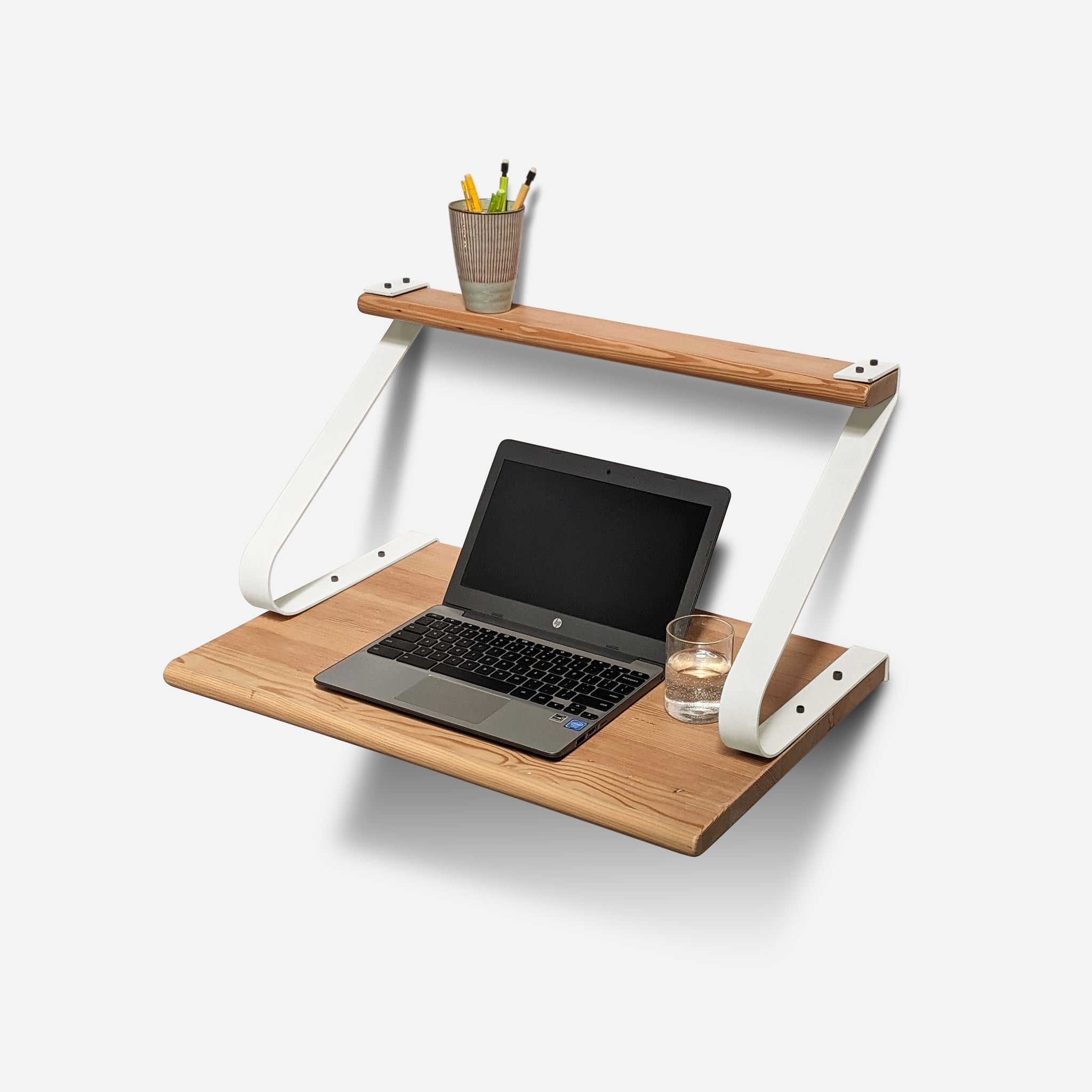 underSTUDY desk in three sizes, showcasing its sleek design and accessory shelf, perfect for modern workspaces.