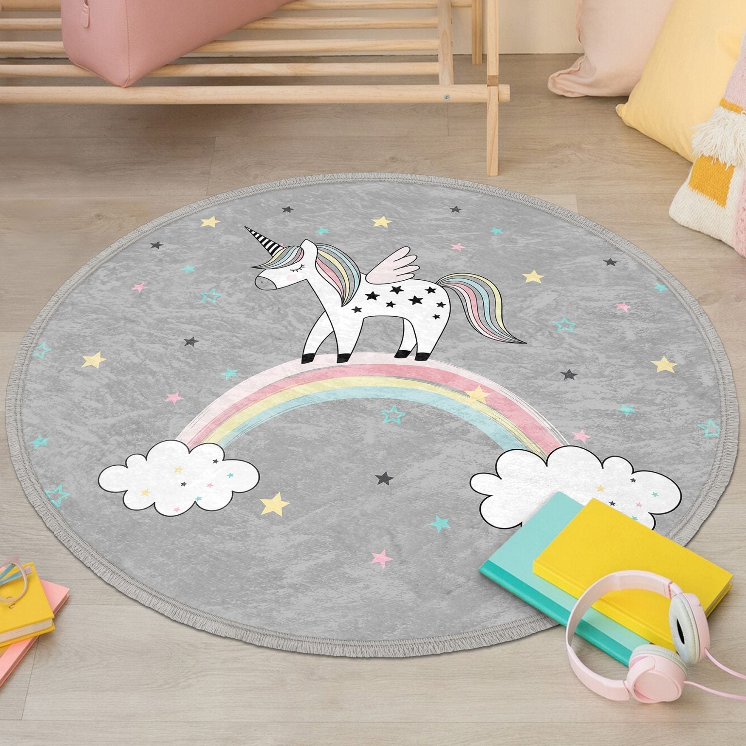 A colorful unicorn printed circle rug designed for kids' rooms, featuring soft velvet fabric and fringes, perfect for nurseries and play areas.