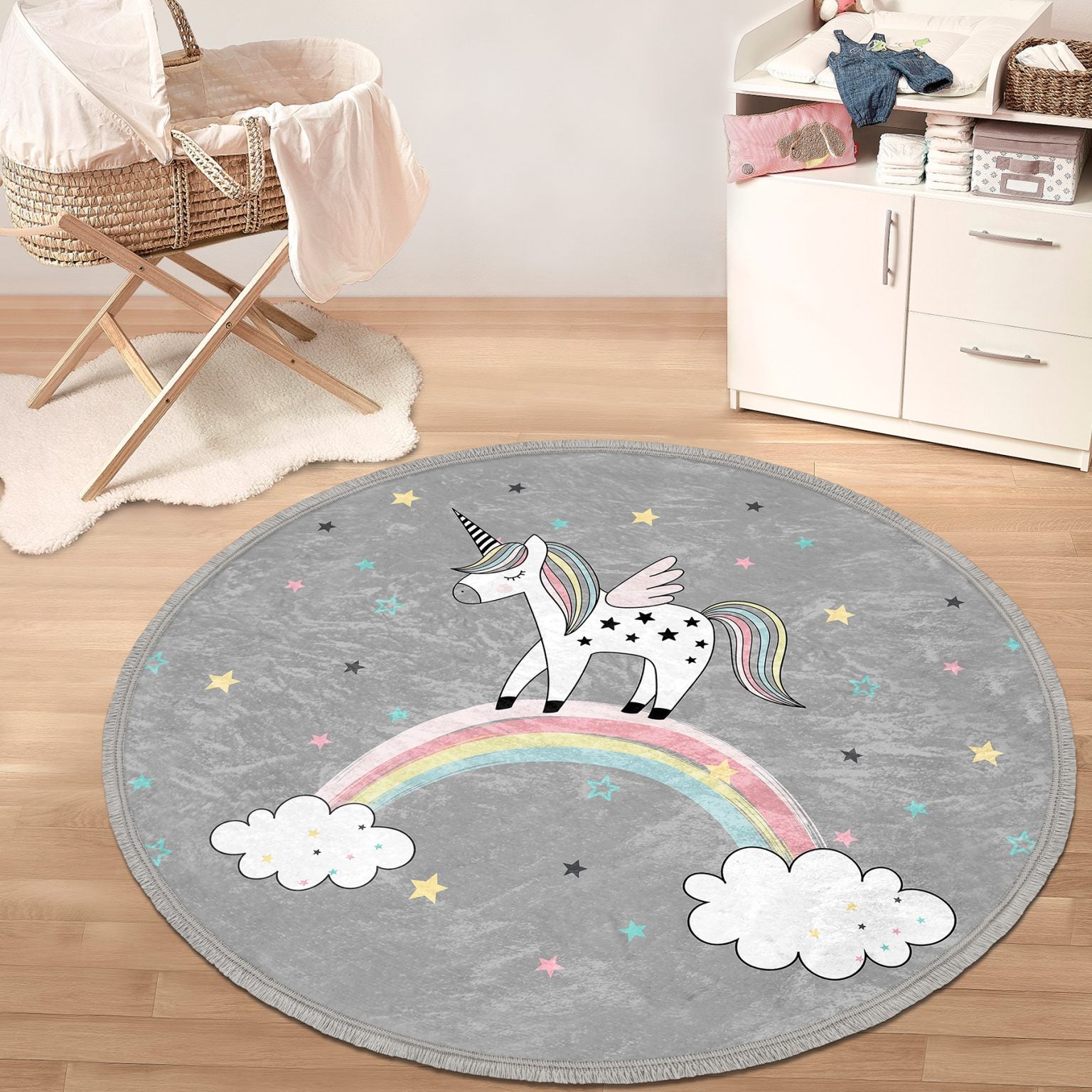 A colorful unicorn printed circle rug designed for kids' rooms, featuring soft velvet fabric and fringes, perfect for nurseries and play areas.