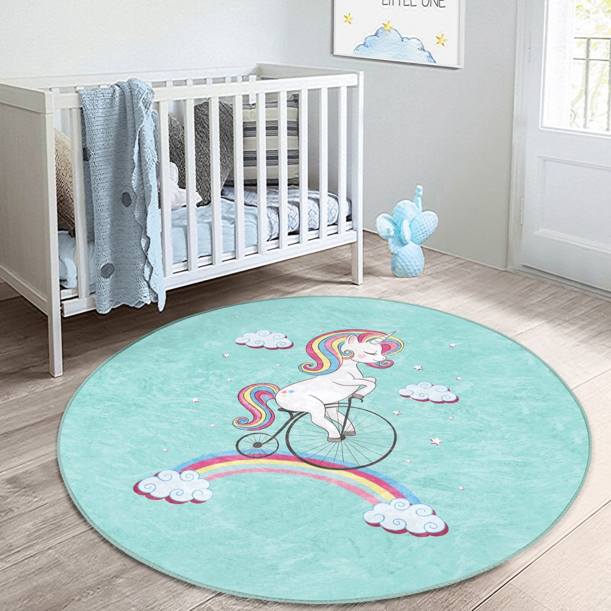 A colorful kids rug featuring a unicorn riding a bicycle on a rainbow, designed for playful and cozy environments.