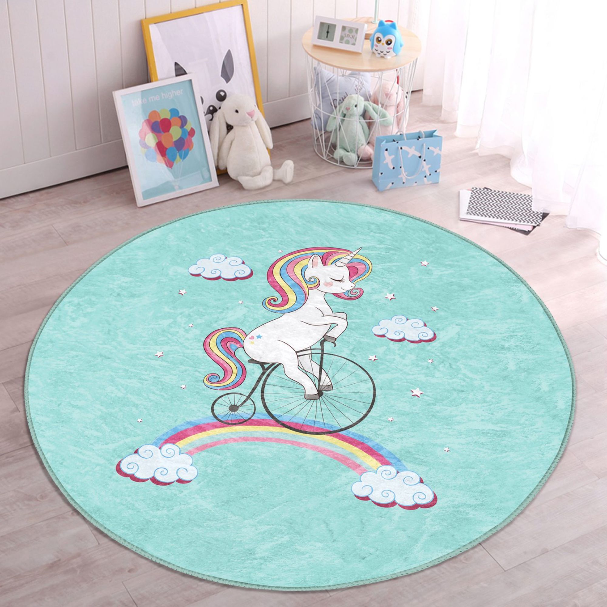 A colorful kids rug featuring a unicorn riding a bicycle on a rainbow, designed for playful and cozy environments.