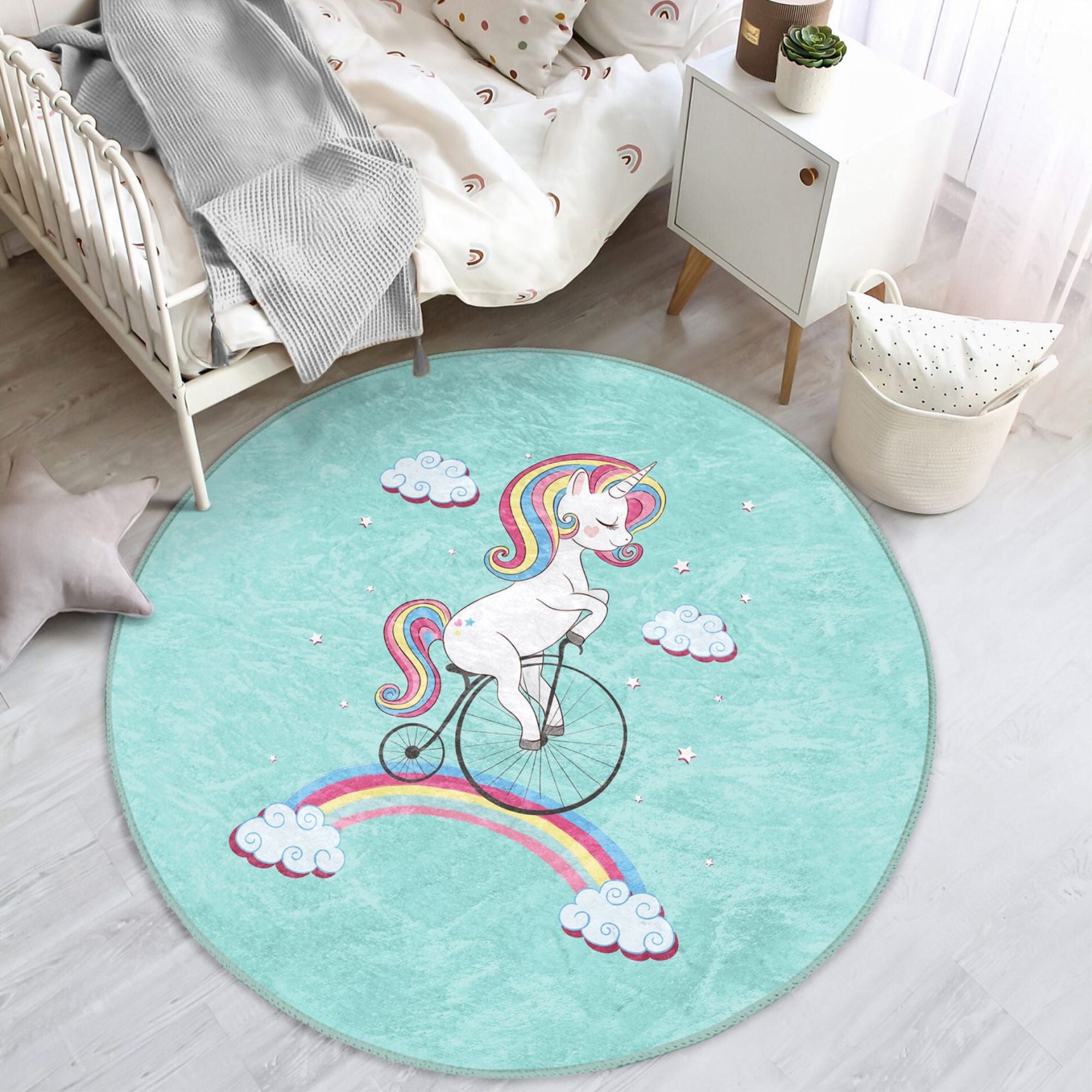 A colorful kids rug featuring a unicorn riding a bicycle on a rainbow, designed for playful and cozy environments.