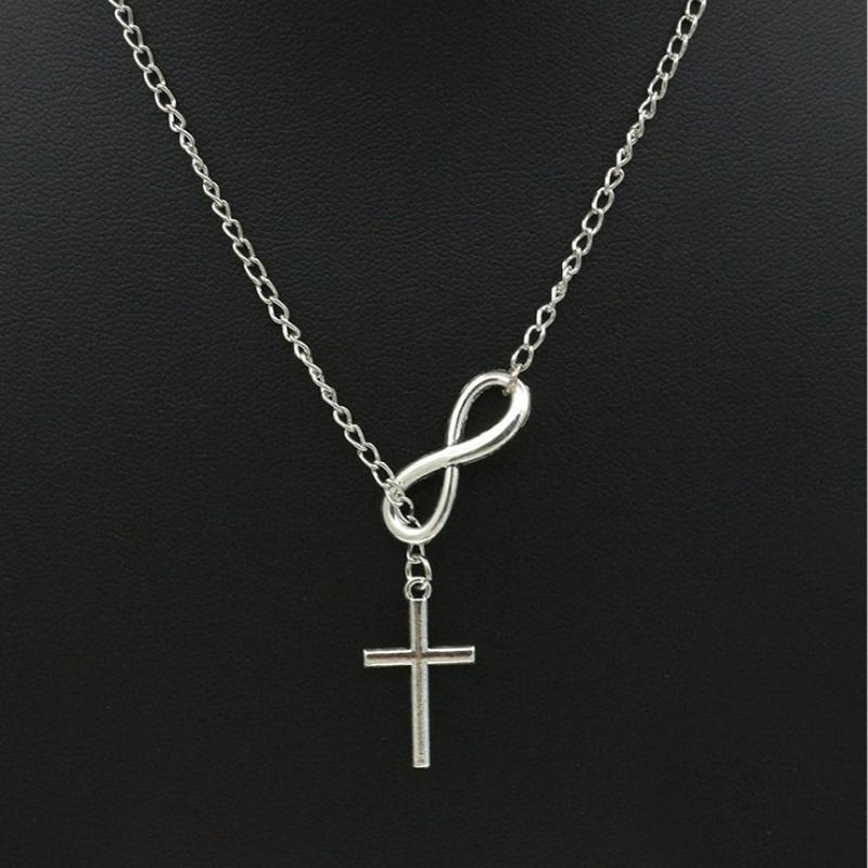 A beautiful Unique Infinity Cross Necklace for Women made of zinc alloy, featuring a stylish infinity cross pendant in silver color.