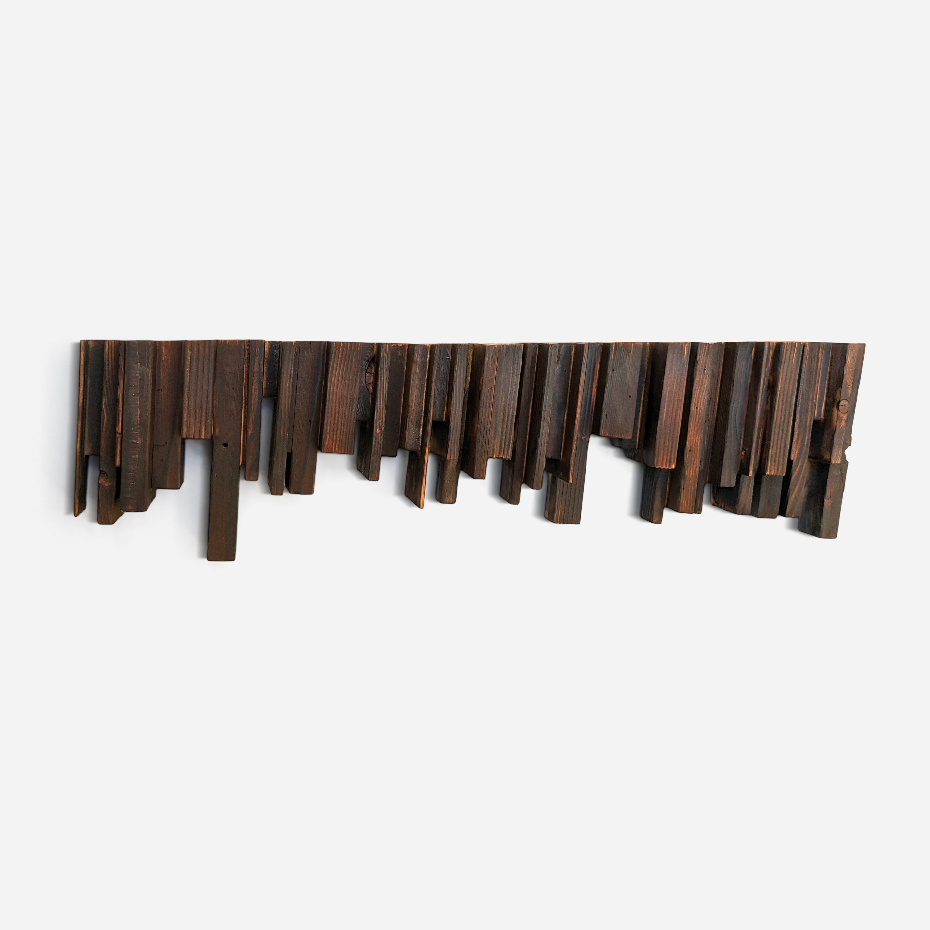 Untitled #9 wall-mounted art piece made from reclaimed wood, showcasing an organized chaos design with exposed end grain and charred sides.