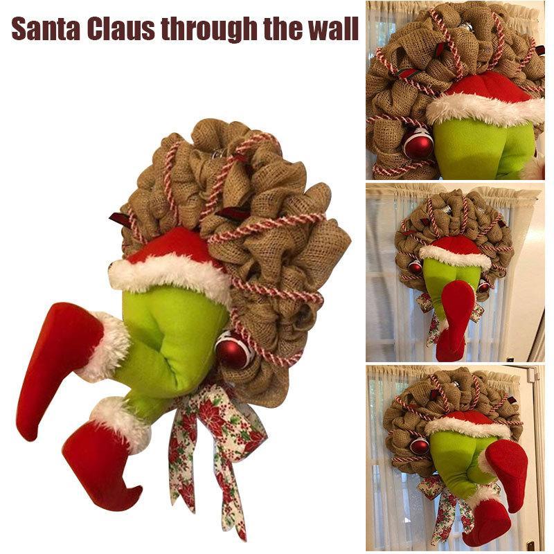 How the Grinch Stole Christmas Burlap Wreath featuring poseable plush legs and festive ornaments, perfect for holiday decoration.