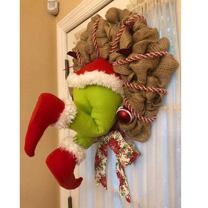 How the Grinch Stole Christmas Burlap Wreath featuring poseable plush legs and festive ornaments, perfect for holiday decoration.