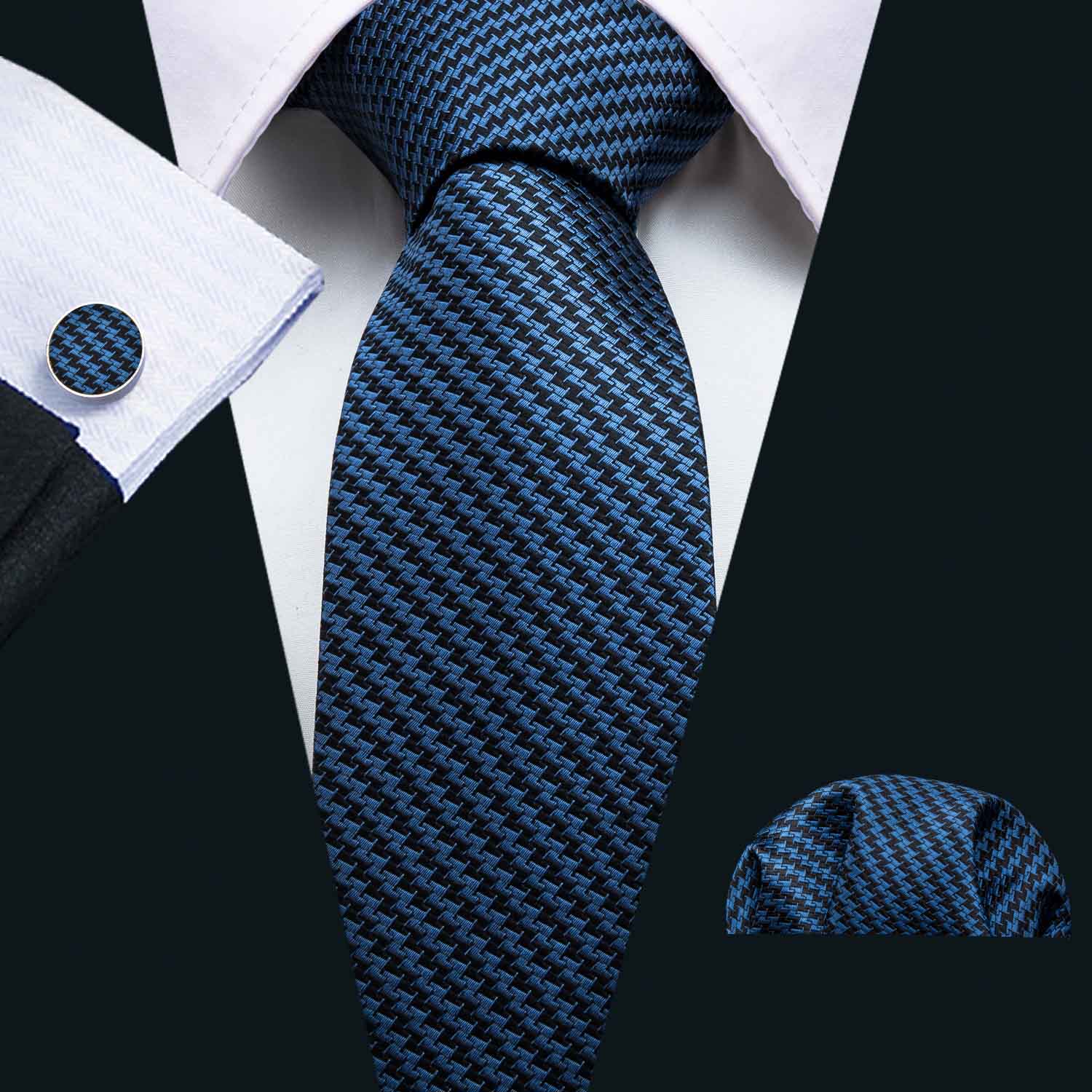 Luxury blue and black silk tie gift set featuring a classic paisley design, cufflinks, and a handkerchief, elegantly displayed.