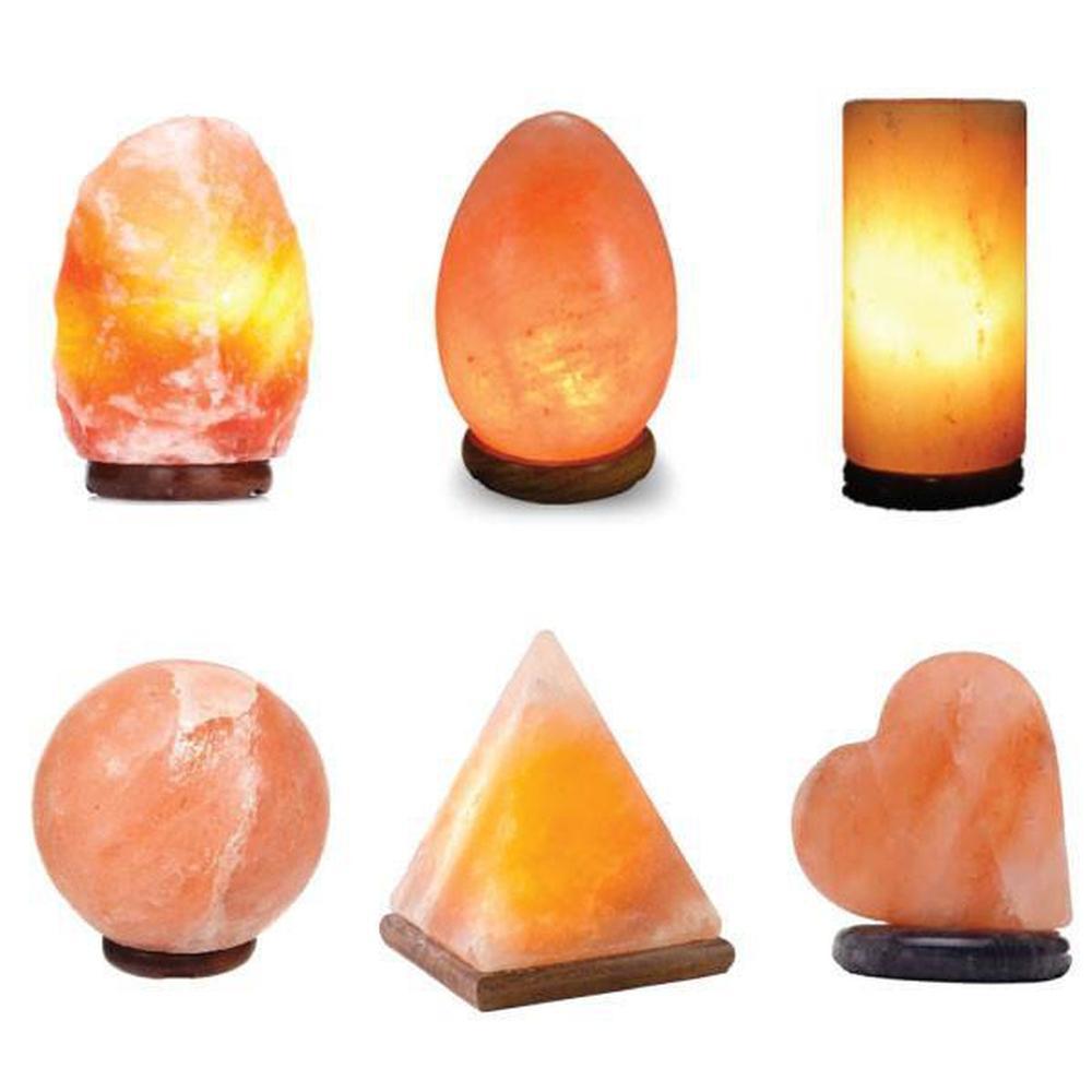 USB Himalayan Pink Rock Salt Lamp with carved shapes, glowing softly, showcasing its natural beauty and LED light.