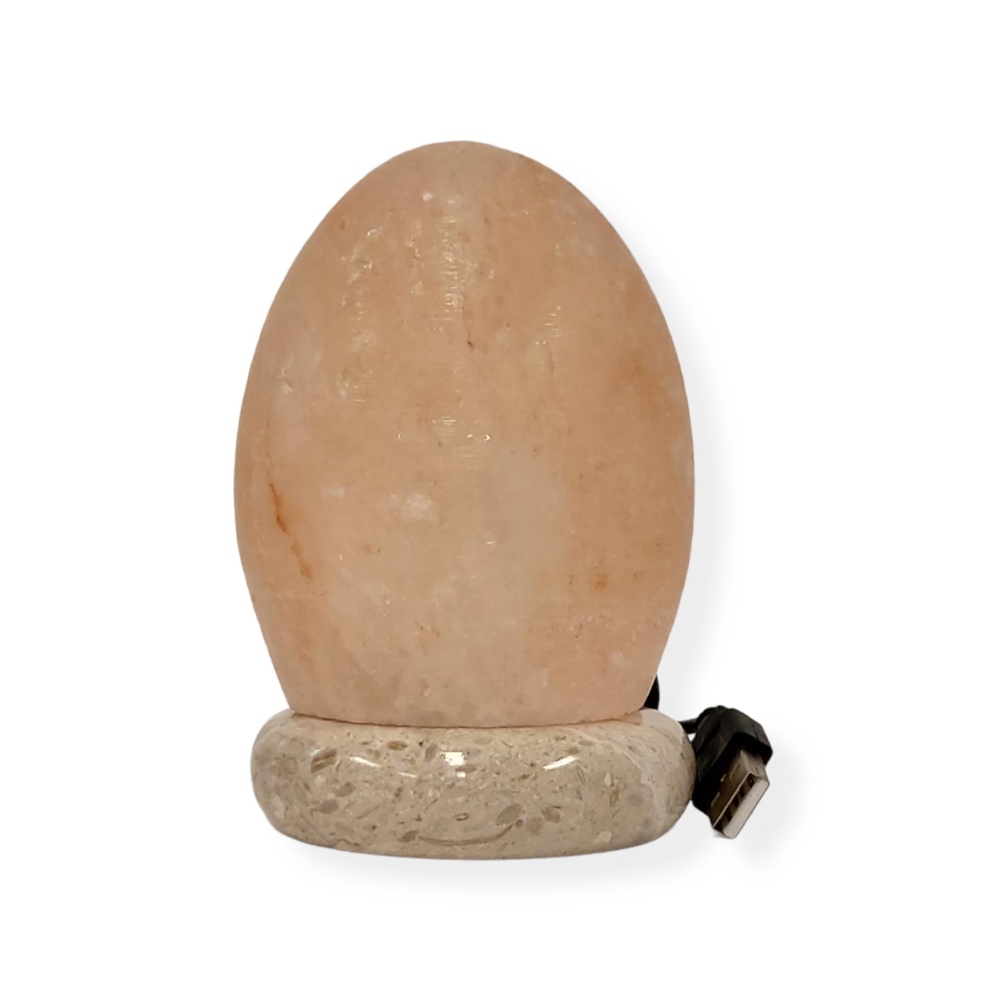 USB Himalayan Pink Rock Salt Lamp with carved shapes, glowing softly, showcasing its natural beauty and LED light.