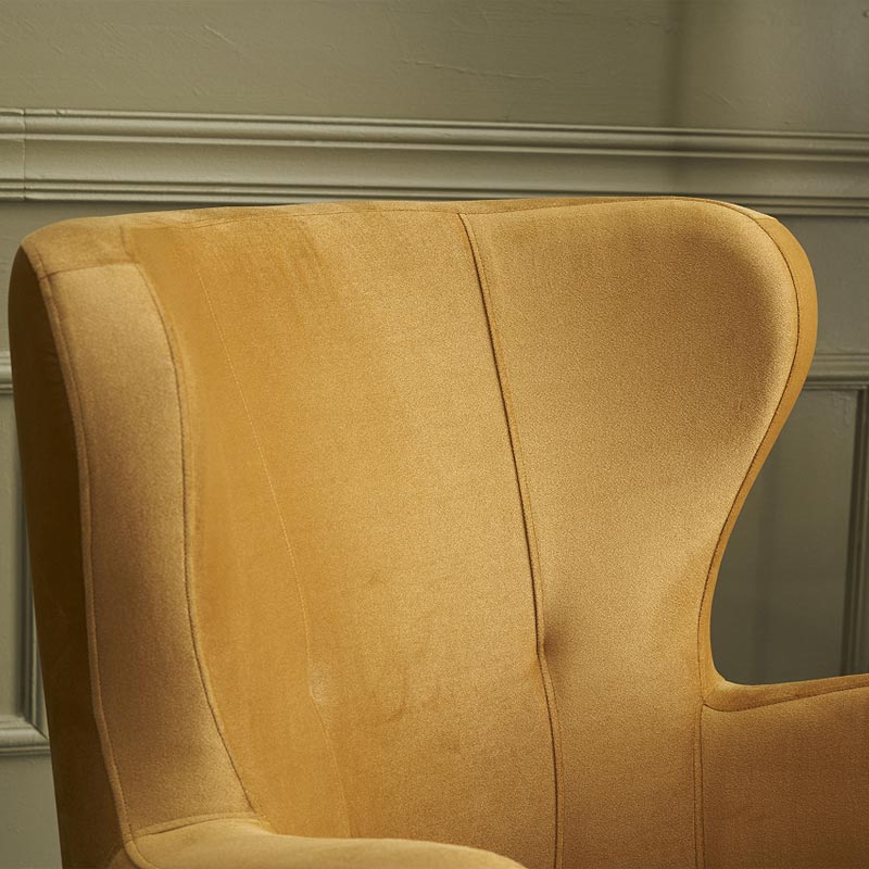 Luxurious Velvet Armchair KING in gold with plush upholstery and walnut wood legs, perfect for stylish interiors.