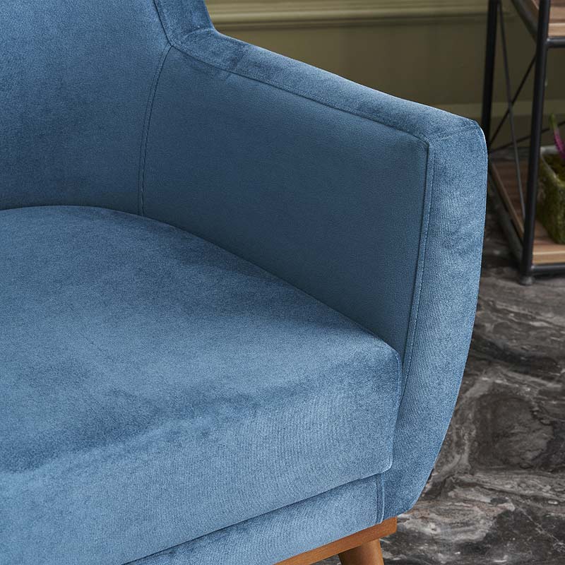 REGATA Blue Velvet Armchair with natural beech wood legs, showcasing plush upholstery and elegant design.