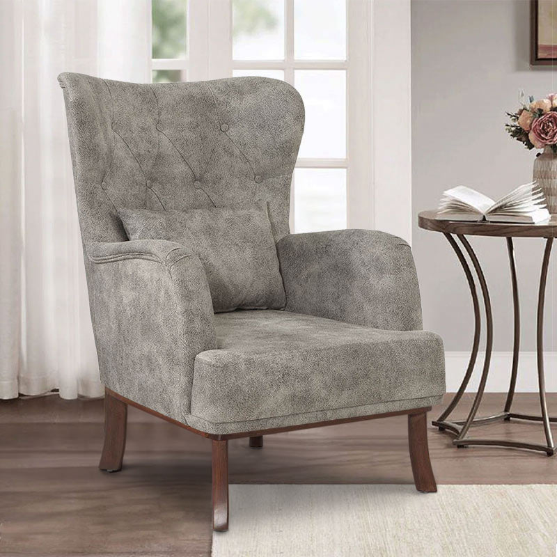 Velvet Armchair ROMEO in grey, featuring plush upholstery and natural wood legs, perfect for stylish relaxation.