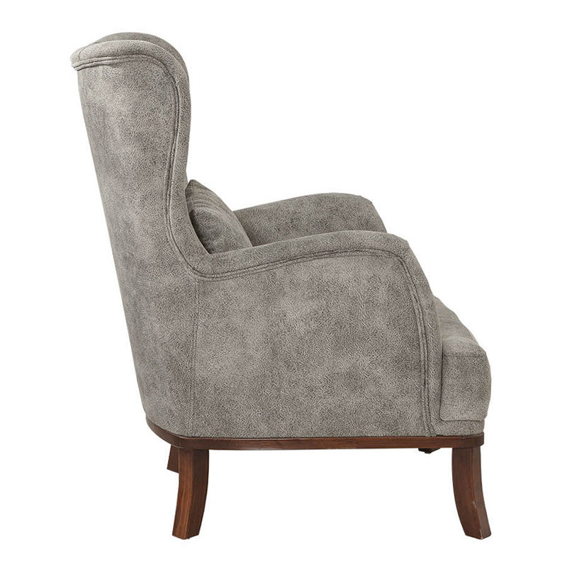 Velvet Armchair ROMEO in grey, featuring plush upholstery and natural wood legs, perfect for stylish relaxation.