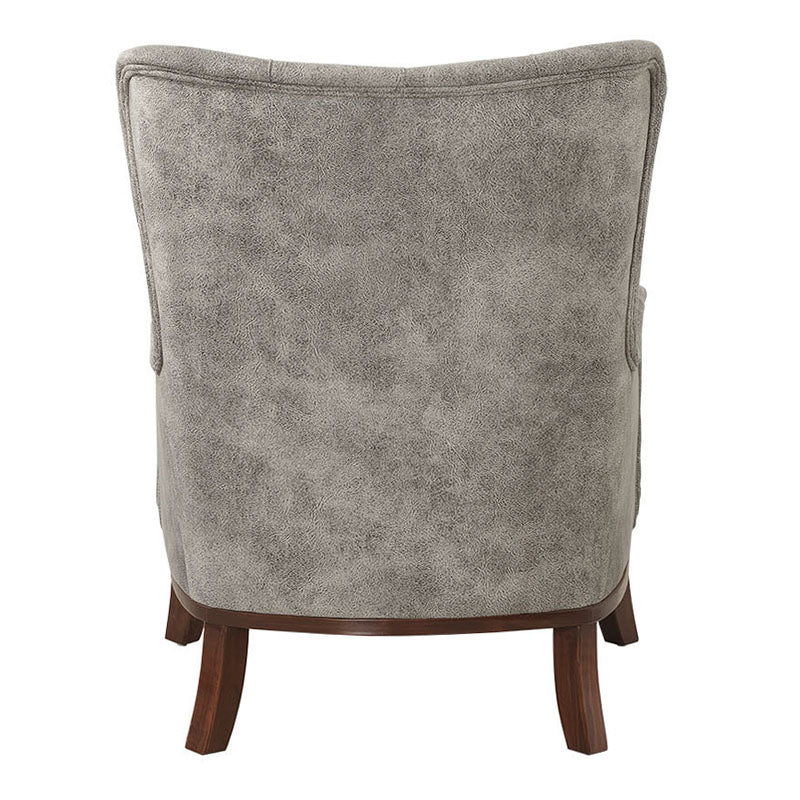 Velvet Armchair ROMEO in grey, featuring plush upholstery and natural wood legs, perfect for stylish relaxation.