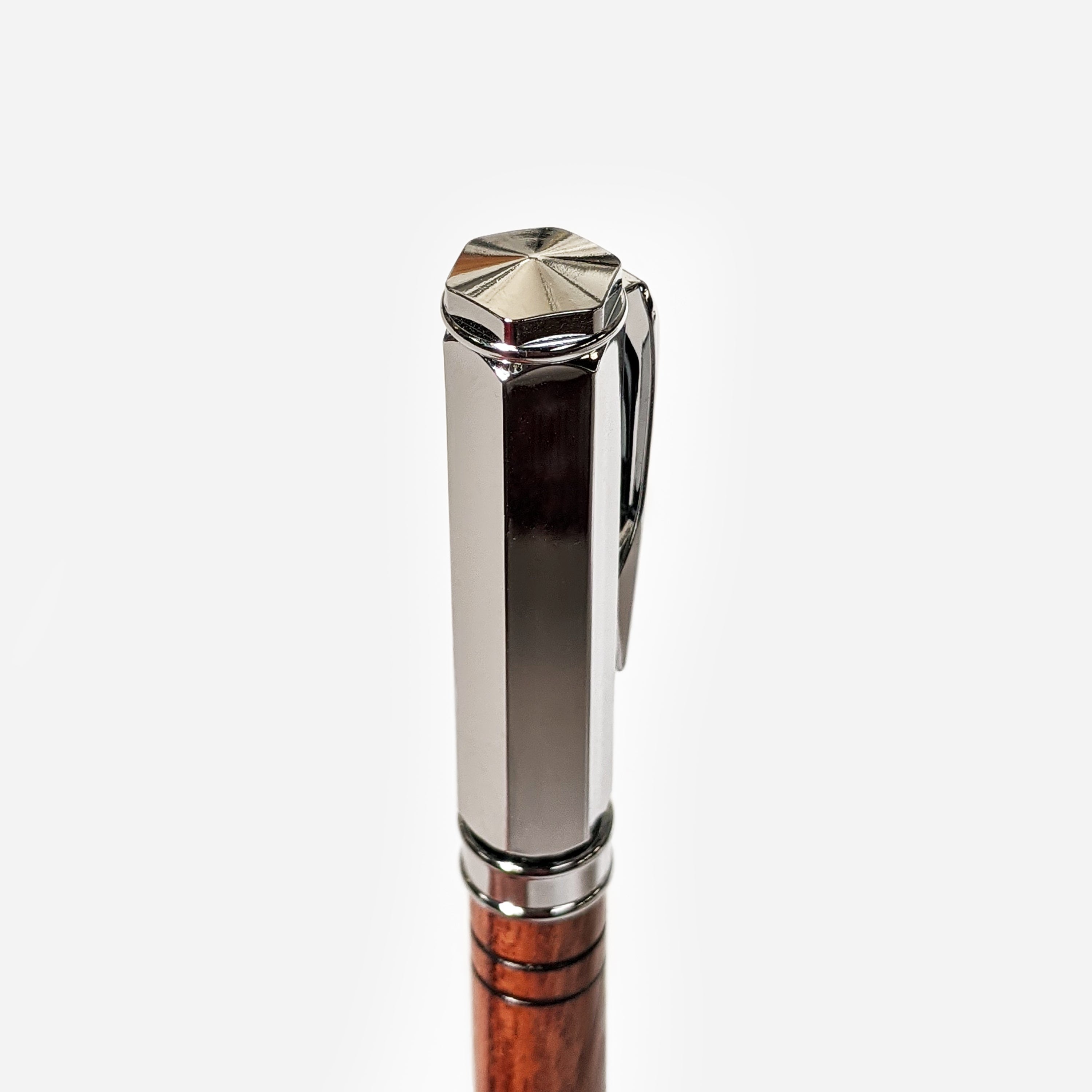 Vertex Rollerball Pen by Cris Wolf featuring a Bubinga wood body and magnetized cap, displayed in a velvet box.