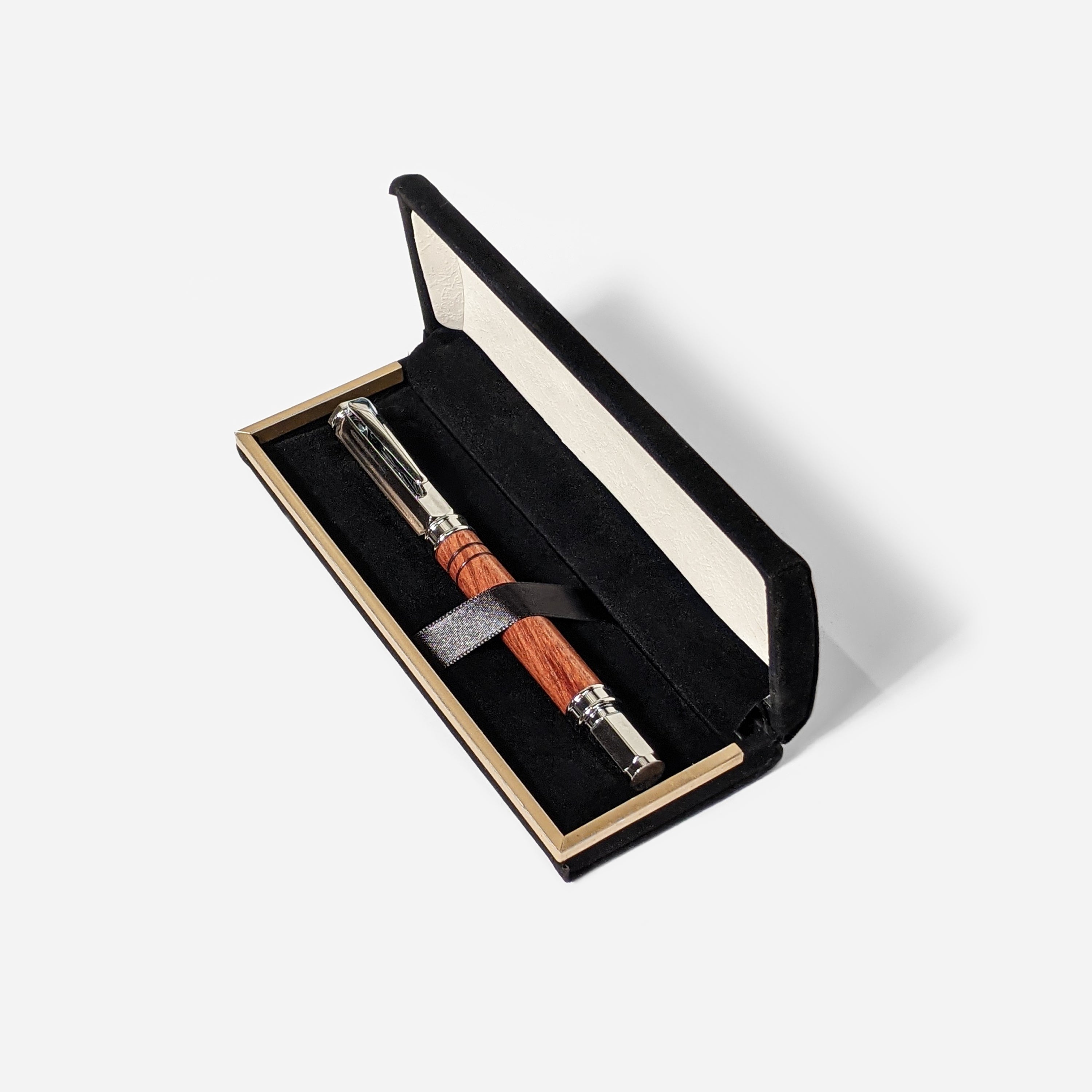 Vertex Rollerball Pen by Cris Wolf featuring a Bubinga wood body and magnetized cap, displayed in a velvet box.