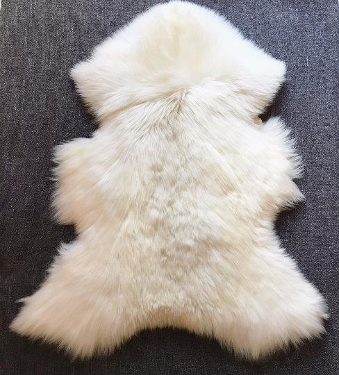 Very Big Bright Ivory Lambskin Rug showcasing its luxurious soft texture and natural ivory color, perfect for home decor.