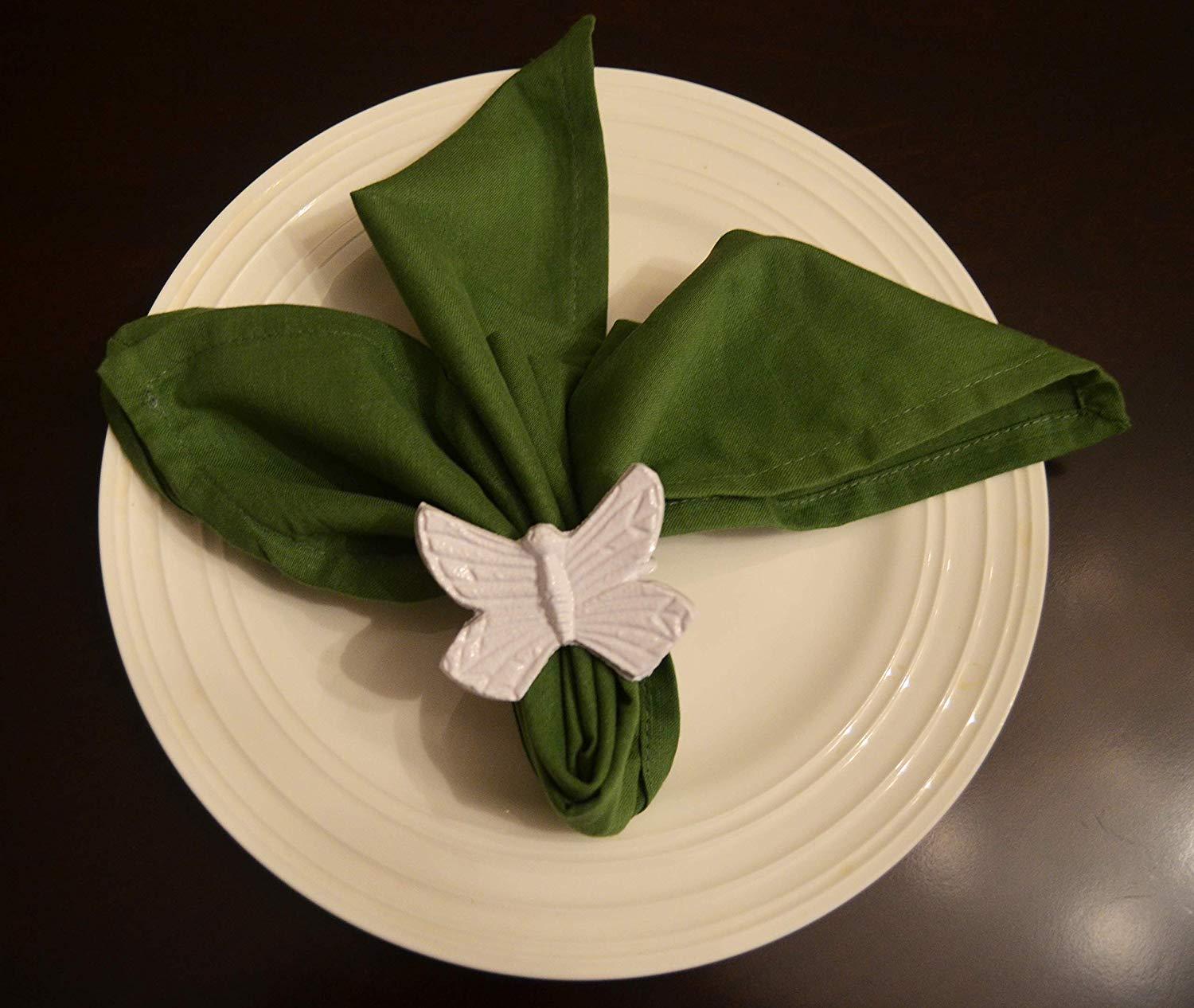 Set of 4 handcrafted aluminum butterfly napkin rings, elegantly designed for upscale dining decor.