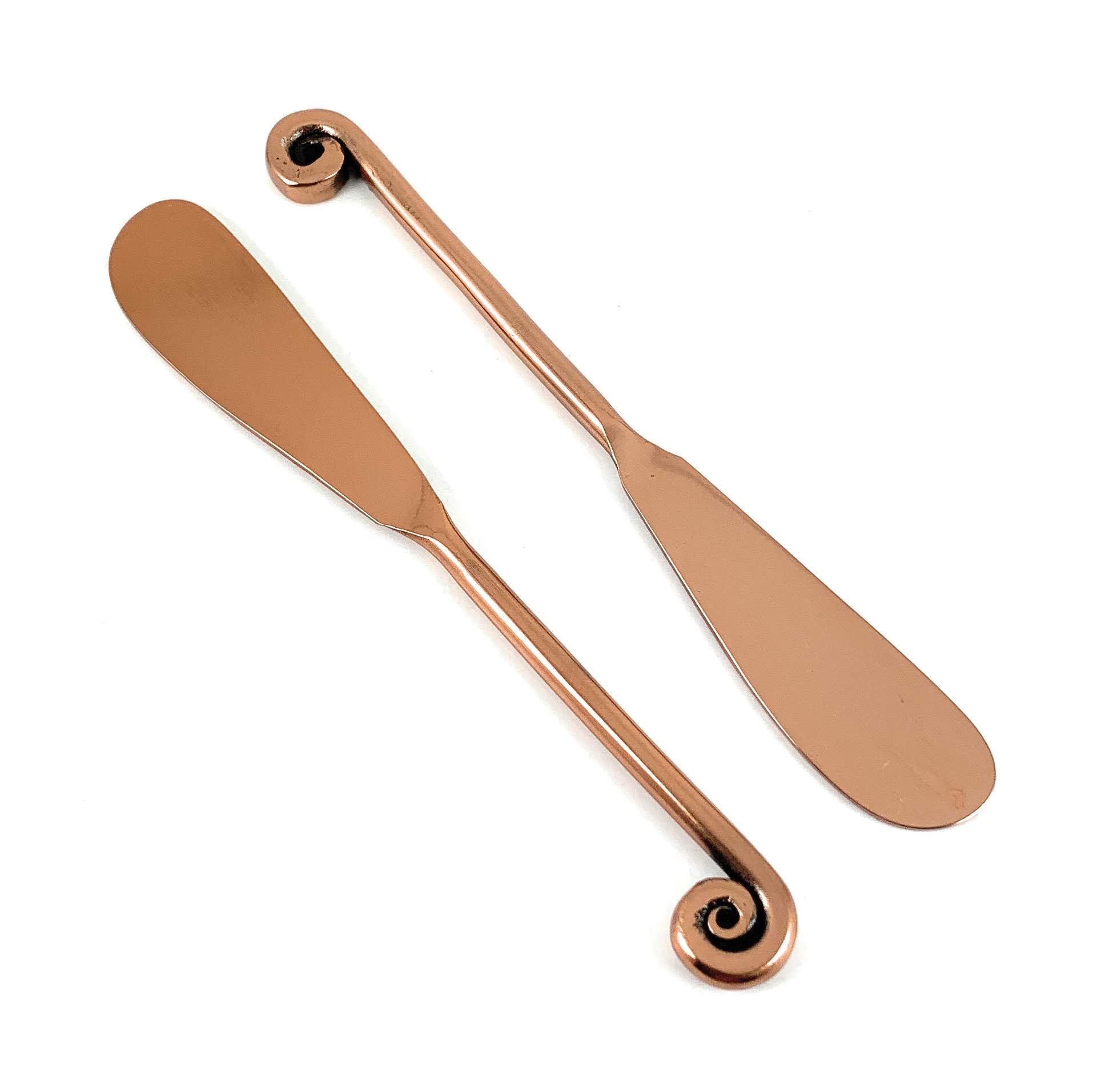 Set of 6 Vibhsa Copper Butter Spreaders with glossy finish, perfect for kitchen and dining decor.