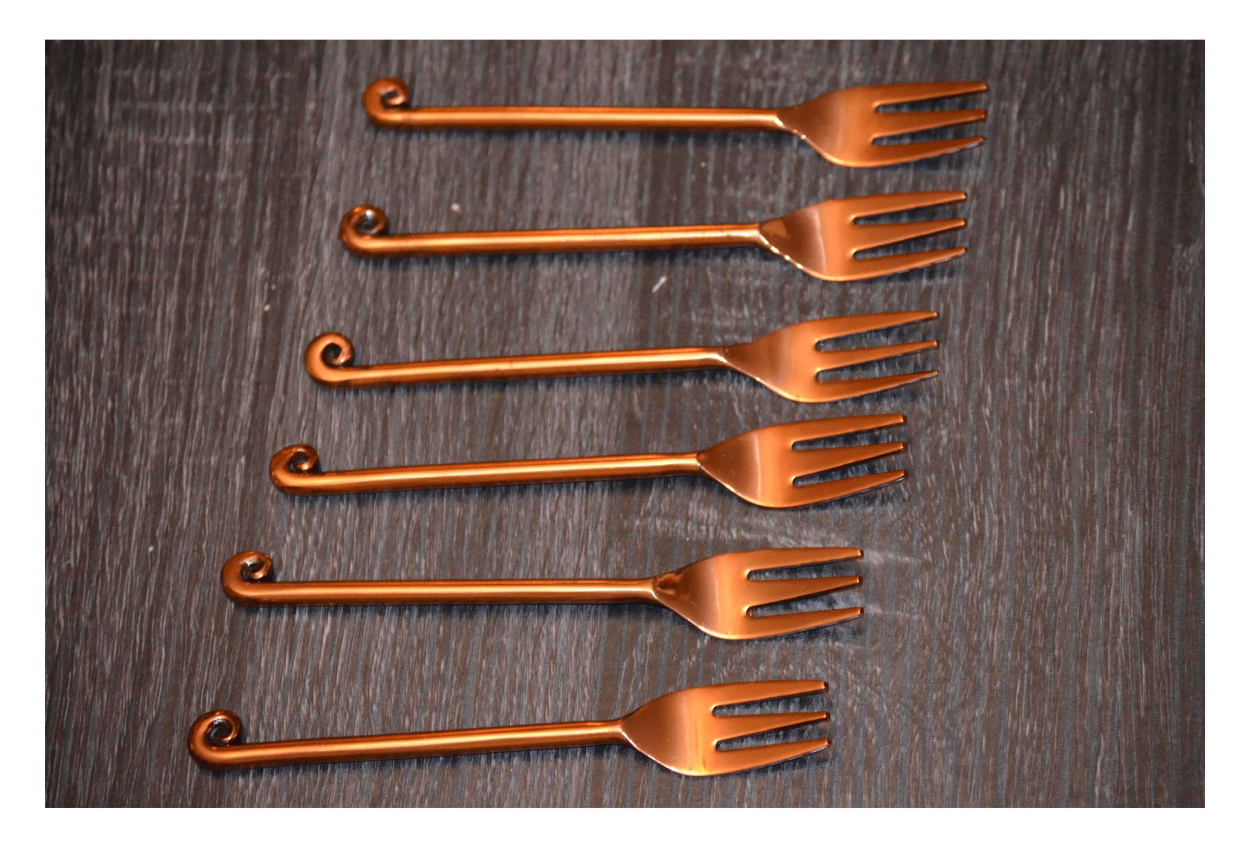 Set of 6 Vibhsa Copper Finish Appetizer Forks with dark rose gold polish, elegantly designed for dining and kitchen decor.