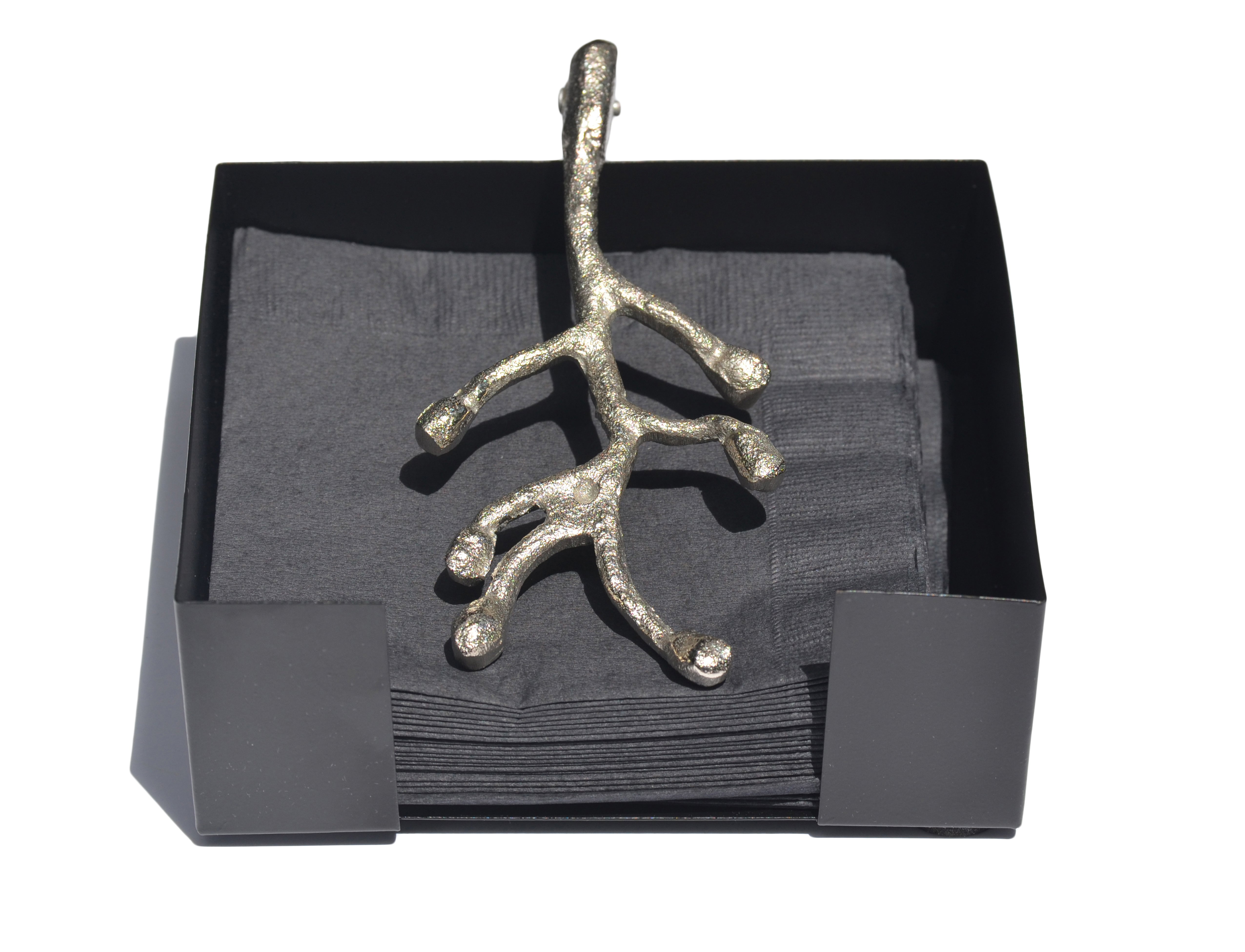 Vibhsa handcrafted silver napkin holder with antique flower bud design, elegantly displayed on a dining table.