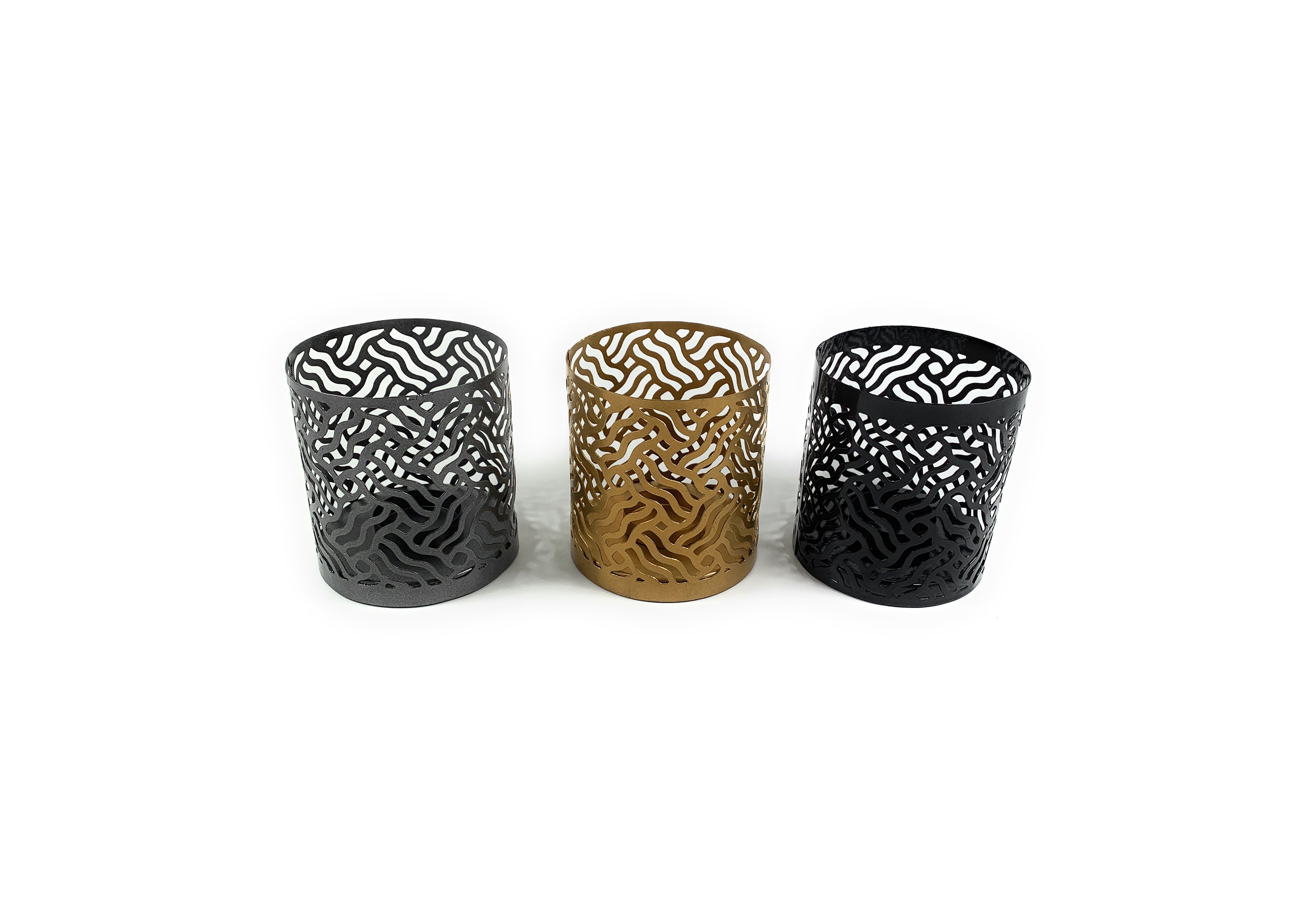 Set of 3 Vibhsa votive candle holders in Black, Grey, and Golden with intricate laser-cut designs, perfect for creating a cozy atmosphere.