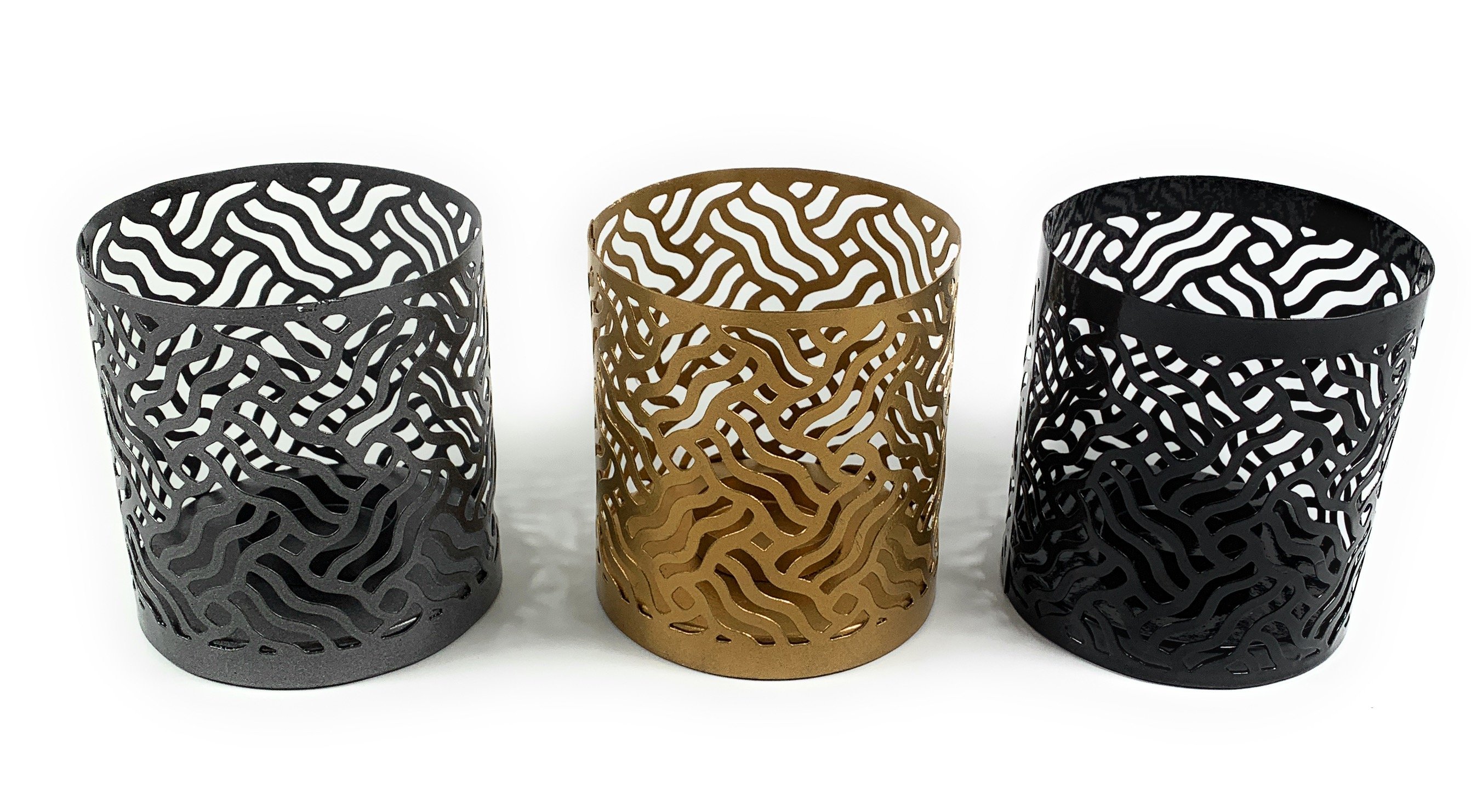 Set of 3 Vibhsa votive candle holders in Black, Grey, and Golden with intricate laser-cut designs, perfect for creating a cozy atmosphere.