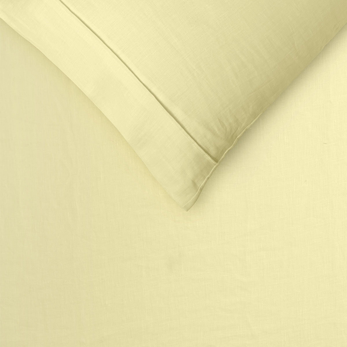 Vintage Design Homewares 100% Linen Butter Quilt Cover Set displayed on a queen-sized bed, showcasing its soft texture and elegant color.