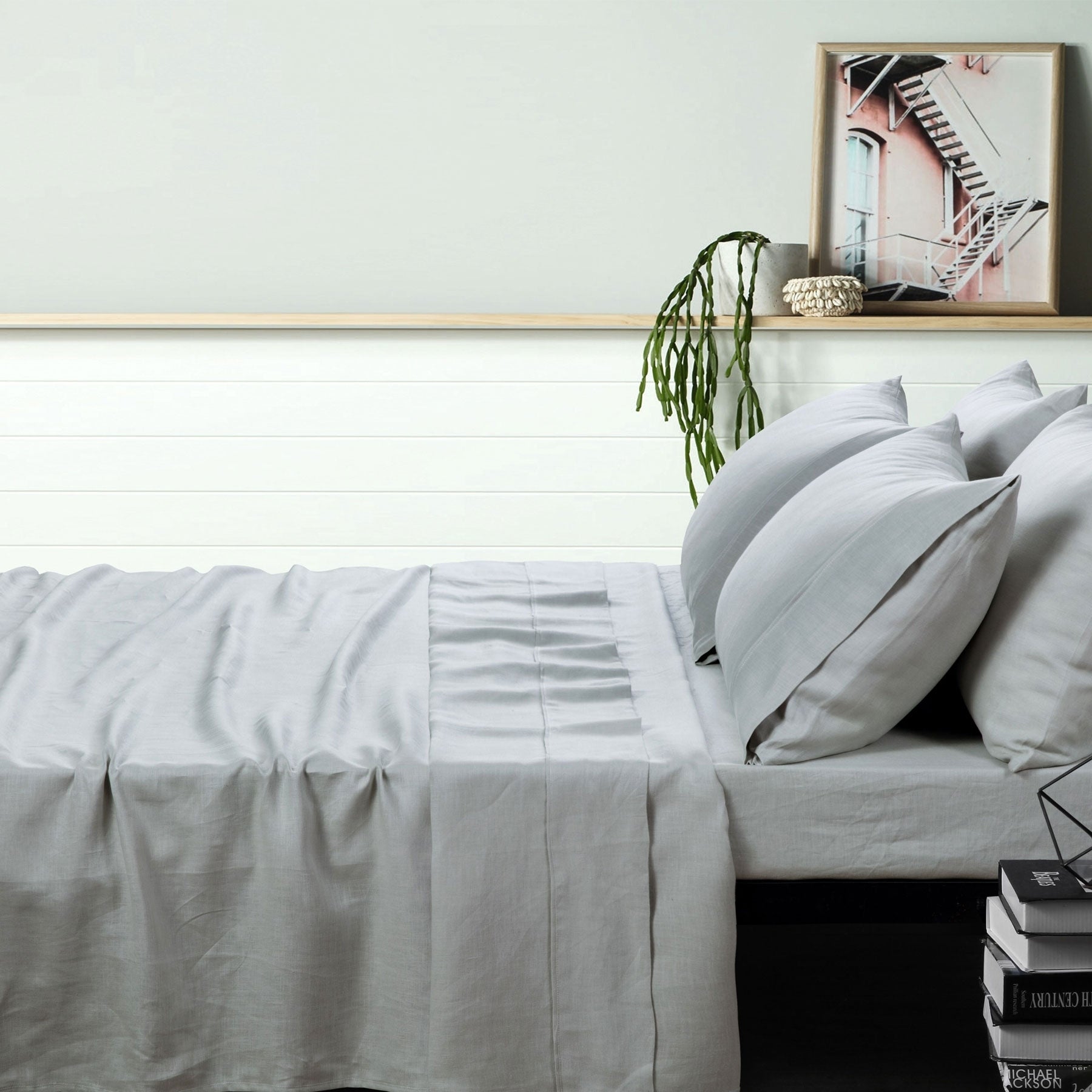 Vintage Design Homewares 100% Linen Dove Grey Sheet Set displayed on a bed, showcasing its elegant color and texture.