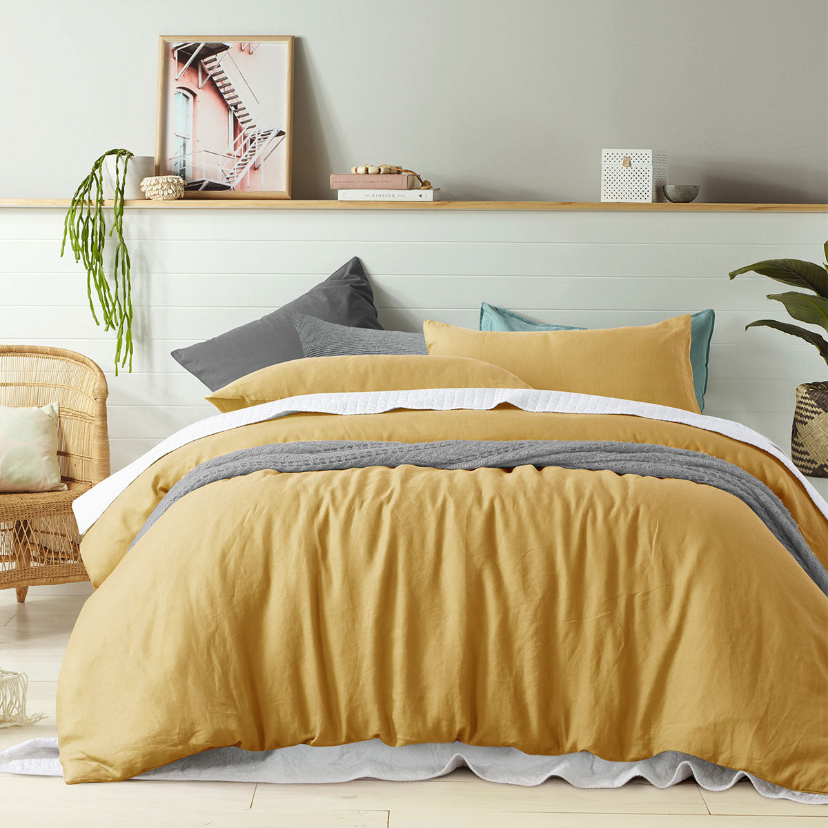 Vintage Design Homewares 100% Linen Ochre Quilt Cover Set displayed on a bed, showcasing its vibrant color and soft texture.