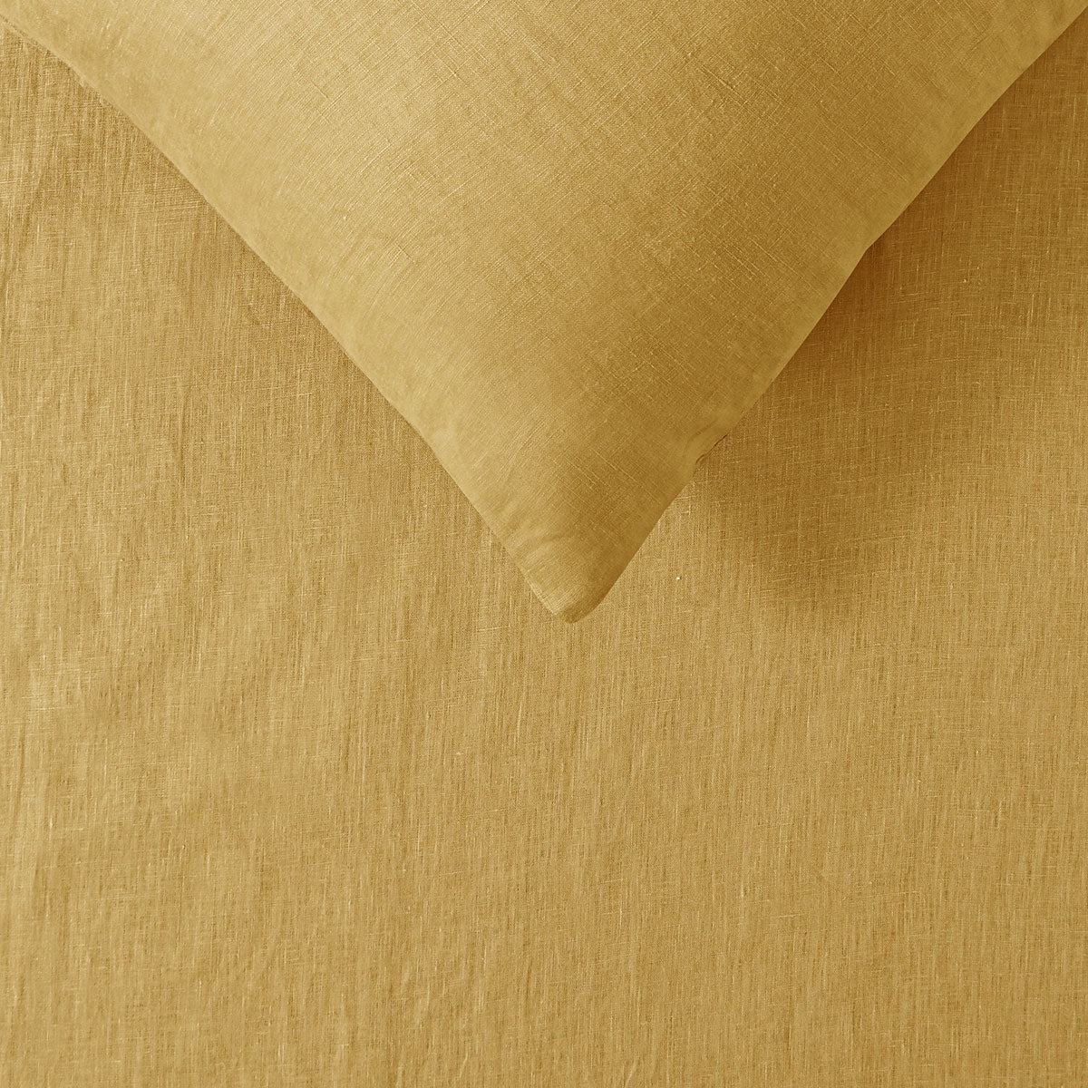 Vintage Design Homewares 100% Linen Ochre Sheet Set King displayed on a bed, showcasing its soft texture and warm color.