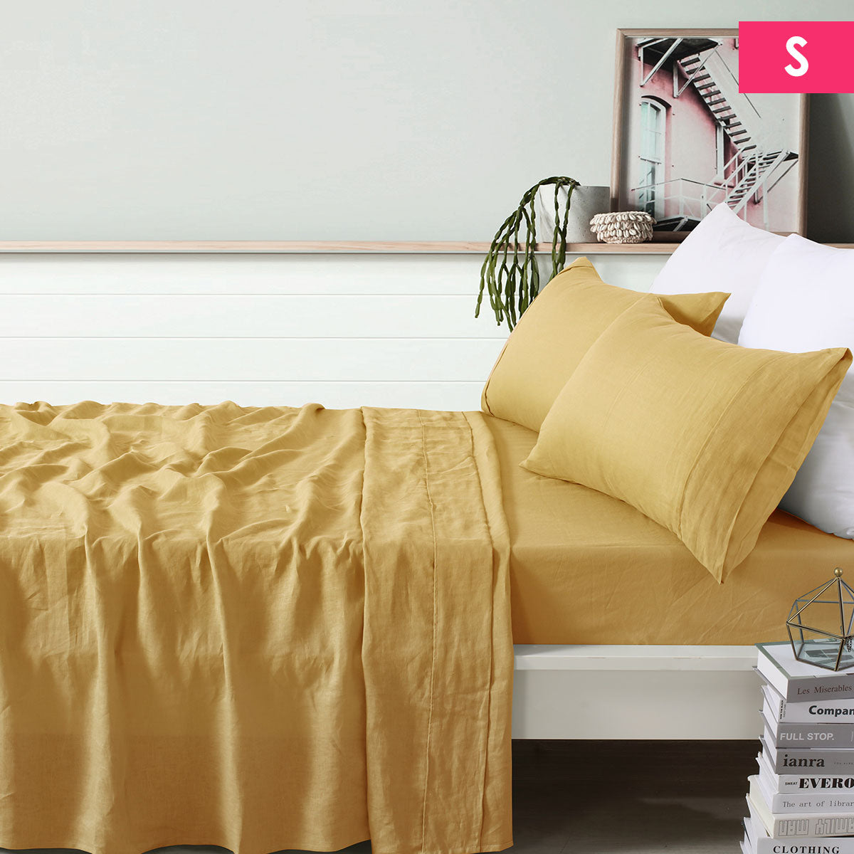 Vintage Design Homewares 100% Linen Ochre Sheet Set displayed on a bed, featuring a flat sheet, fitted sheet, and pillowcase in a warm ochre color.