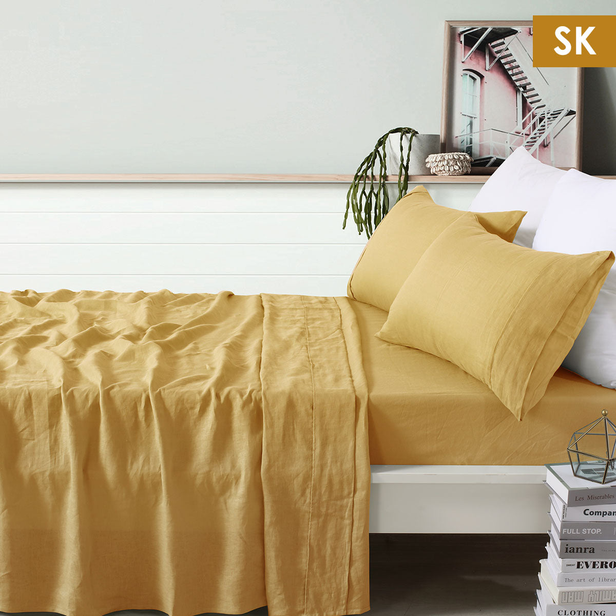 Vintage Design Homewares 100% Linen Ochre Sheet Set displayed on a bed, showcasing its soft texture and warm color.