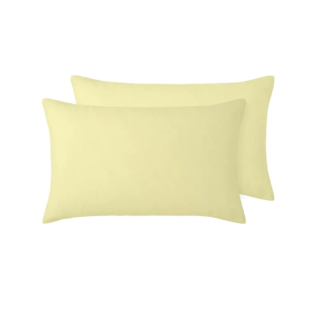 A pair of vintage design standard pillowcases made from 100% linen in a butter color, elegantly displayed on a bed.