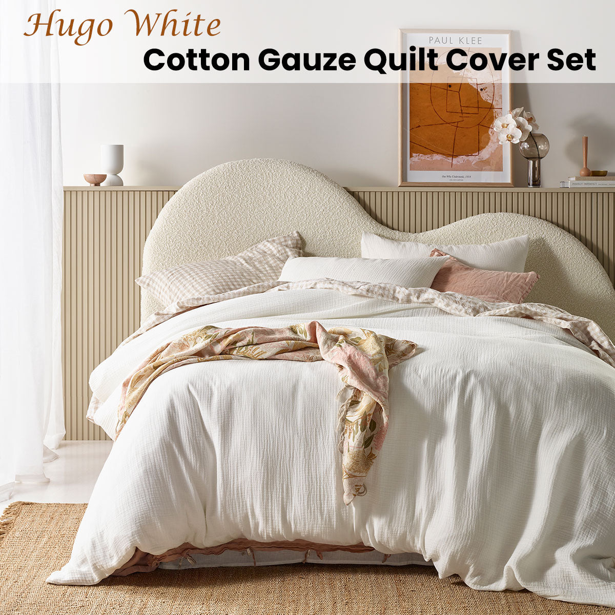 Hugo White Cotton Gauze Quilt Cover Set displayed on a queen-sized bed, showcasing its soft texture and elegant solid colour design.