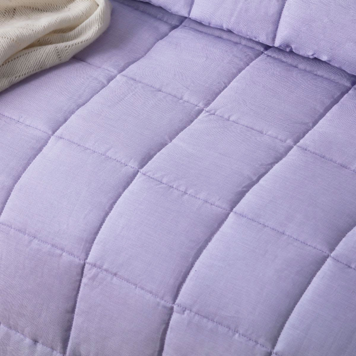 Vintage Design Homewares Lilac French Linen Coverlet Set displayed on a king-sized bed, featuring quilted squares design and soft lilac color.