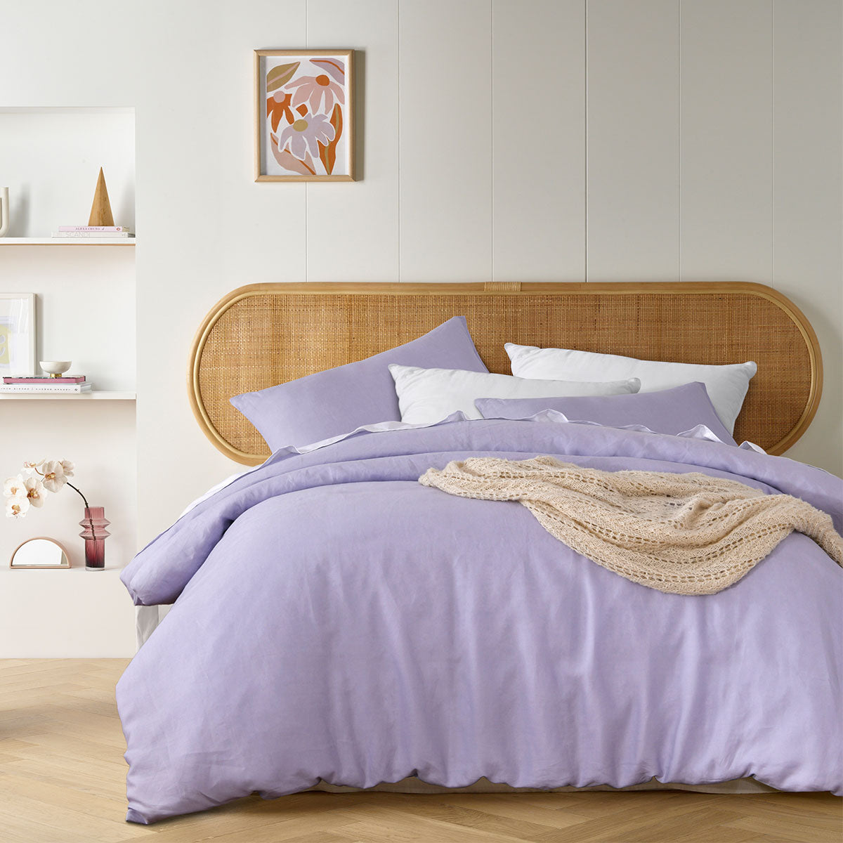 Lilac French Linen Quilt Cover Set displayed on a bed, featuring a solid color design with matching pillowcases.