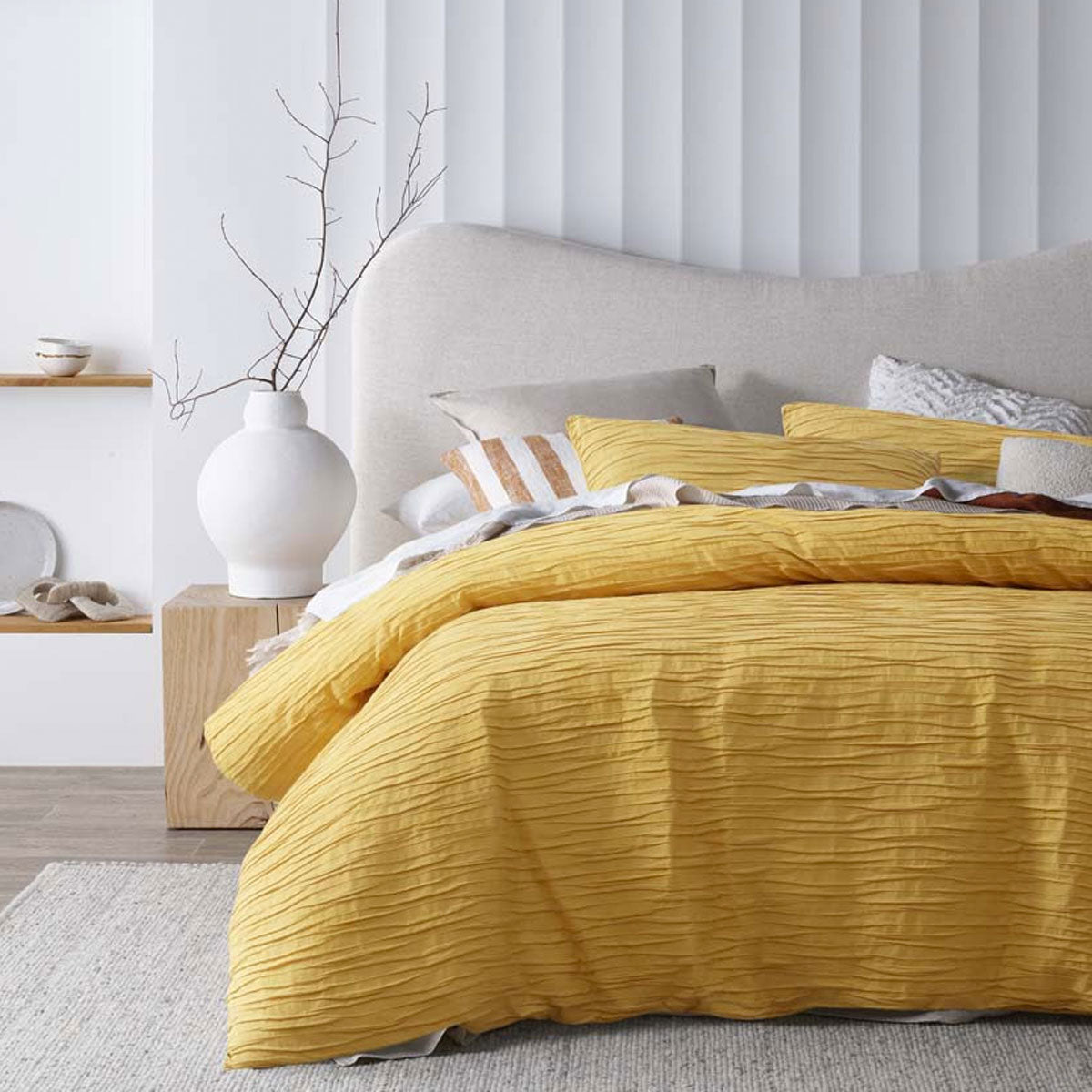 Malvern Ochre Cotton Quilt Cover Set featuring horizontal pleats, perfect for a queen-sized bed.